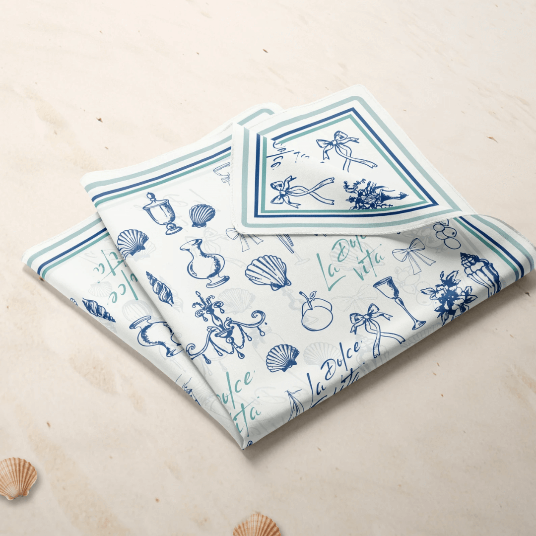 La Dolce Vita Silk scarf featuring Mediterranean doodle illustrations on a light background.