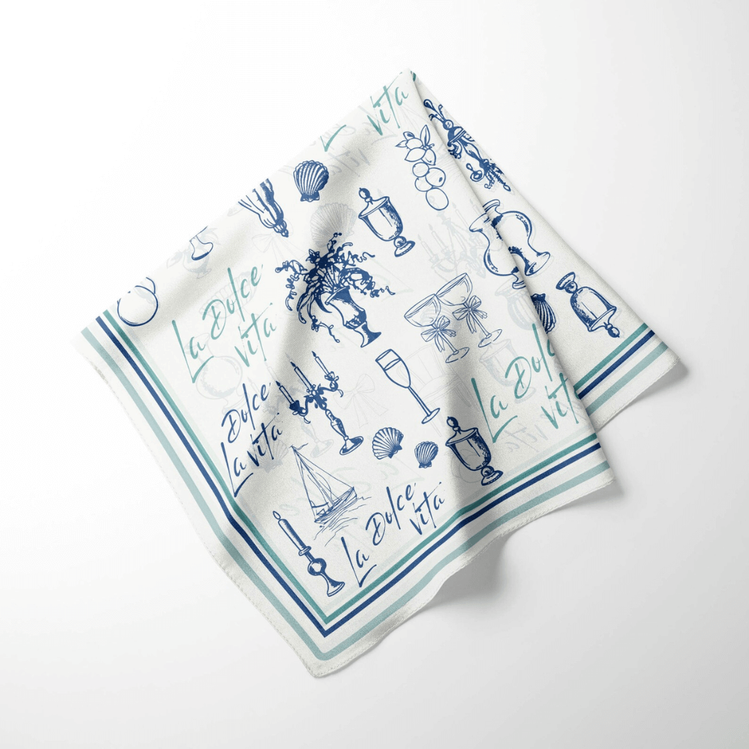 La Dolce Vita Silk scarf featuring Mediterranean doodle illustrations in blue and white.
