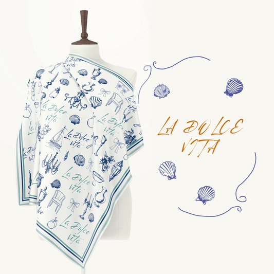 La Dolce Vita Silk scarf featuring Mediterranean doodle illustrations on a mannequin.