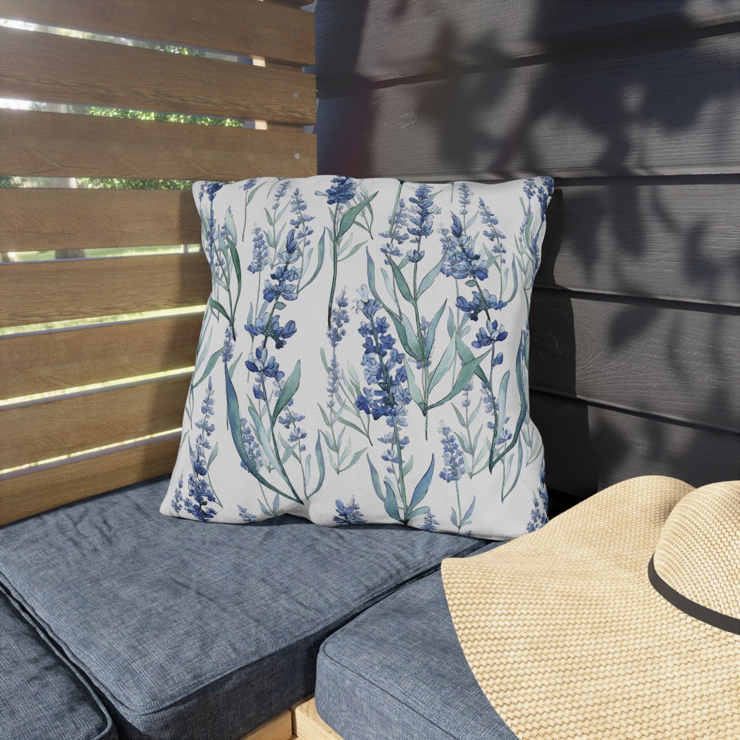 Blue lavender botanical outdoor pillow on patio bench, UV and water-resistant design