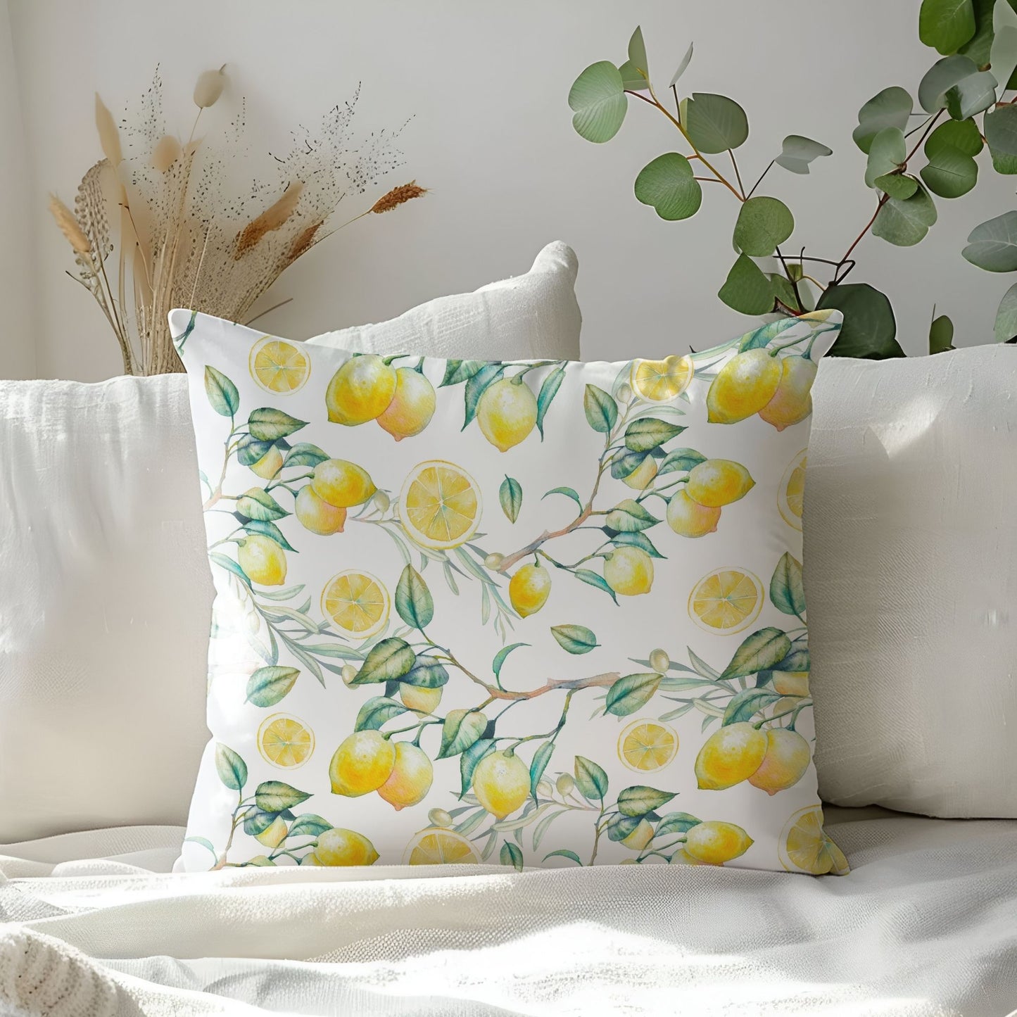 Bright lemon watercolor pillow cover on white couch – fresh summer home decor.