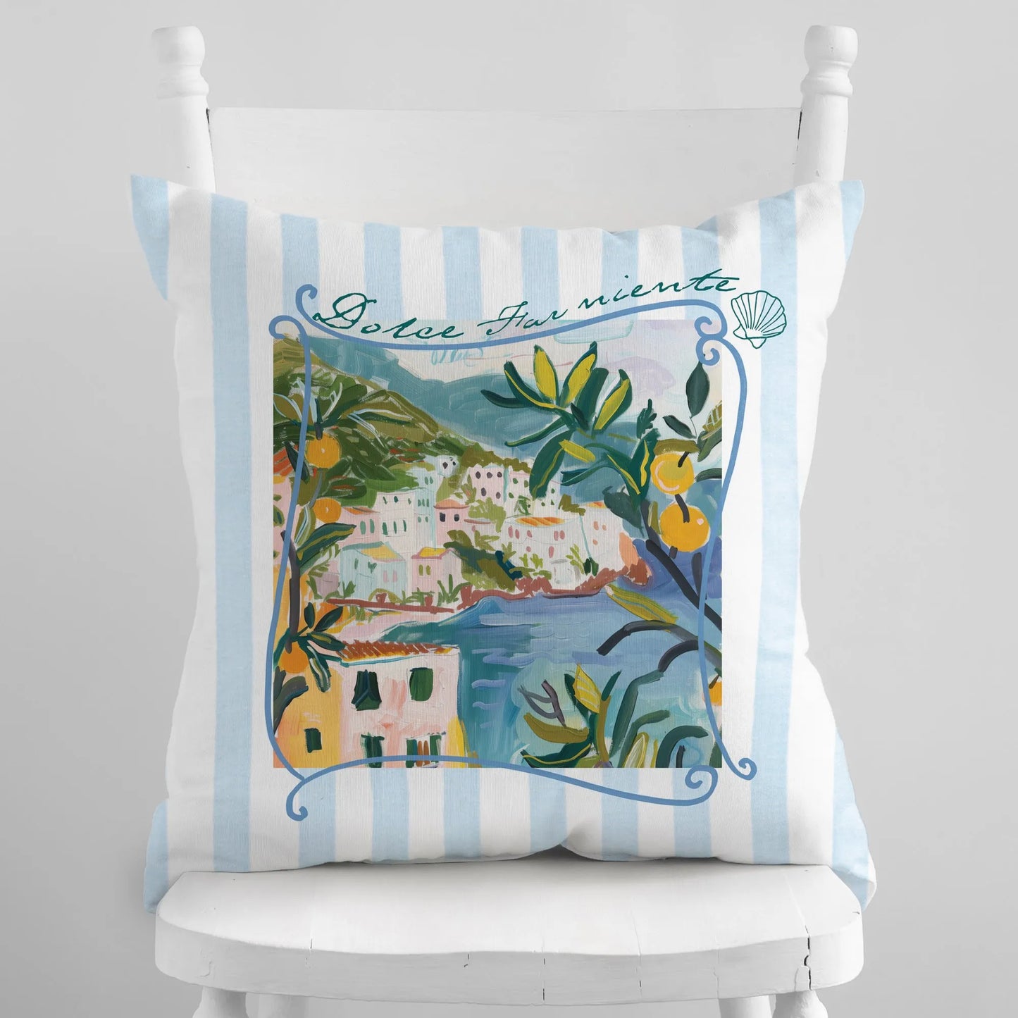 Square pillow featuring an illustrated Amalfi Coast view with lemons, olive leaves, and “Dolce Far Niente” text — Mediterranean summer decor in soft blue and white stripes.