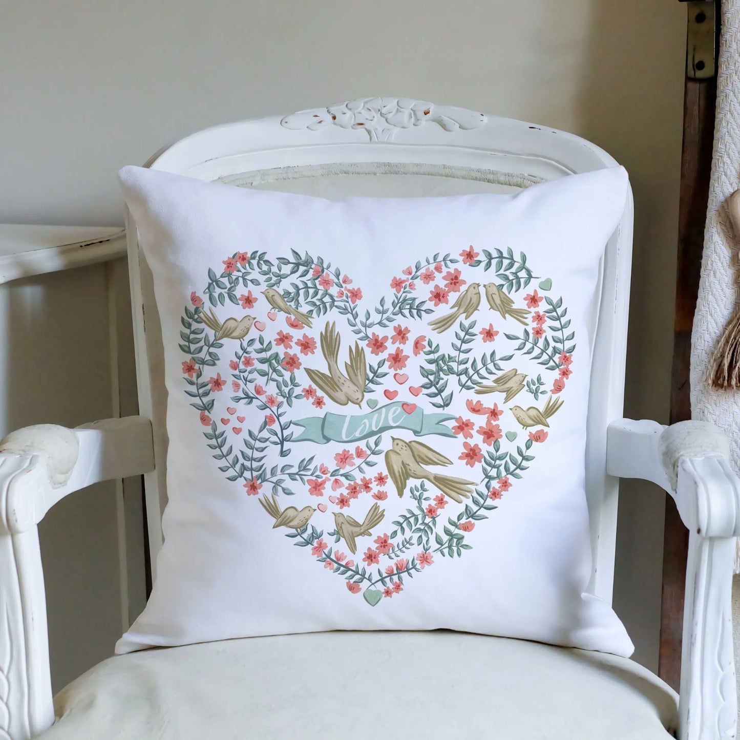vintage white chair with  Love Birds Valentine pillow from Blue Water Songs on it