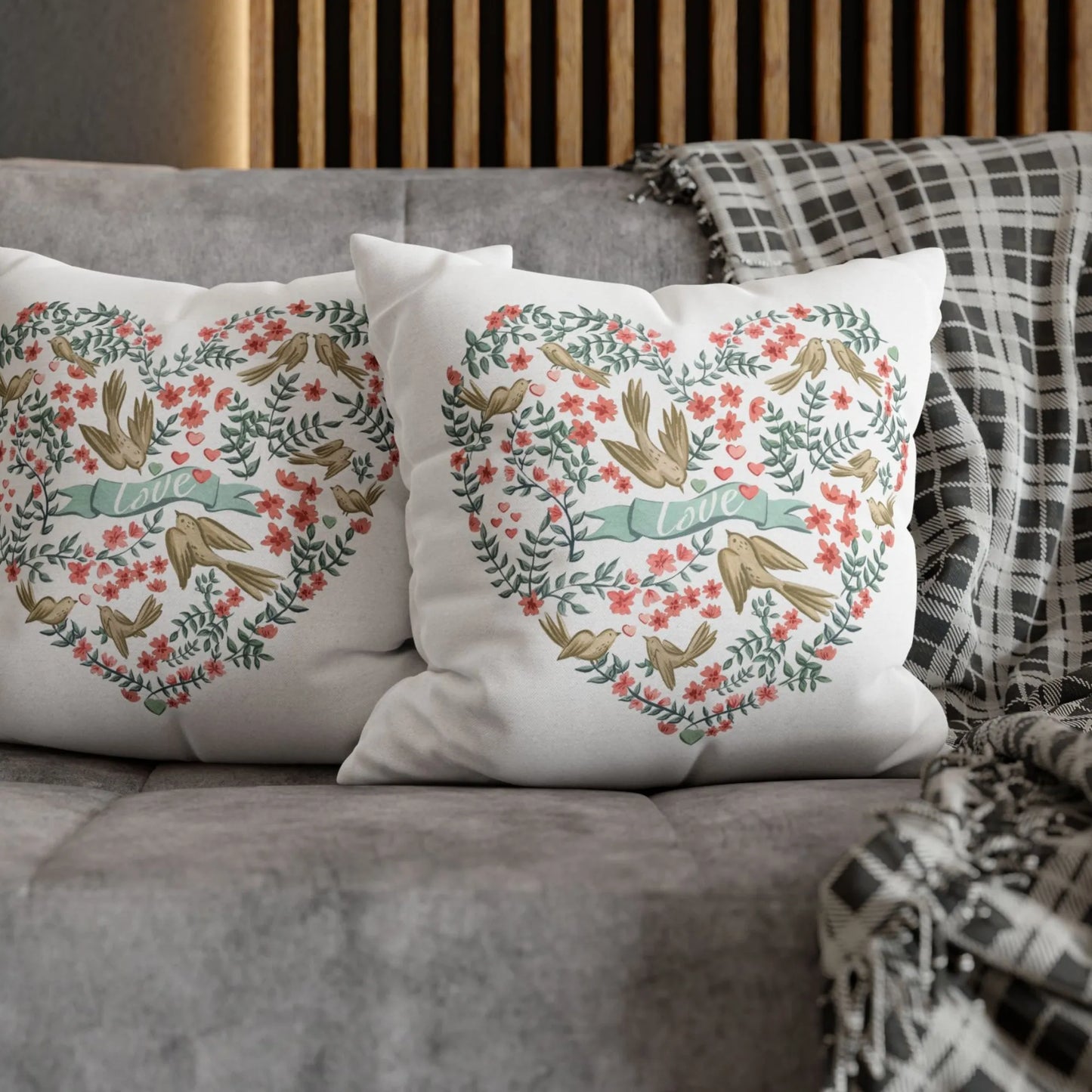 grey sofa with 2 botanical style Love Birds Valentine pillow on it