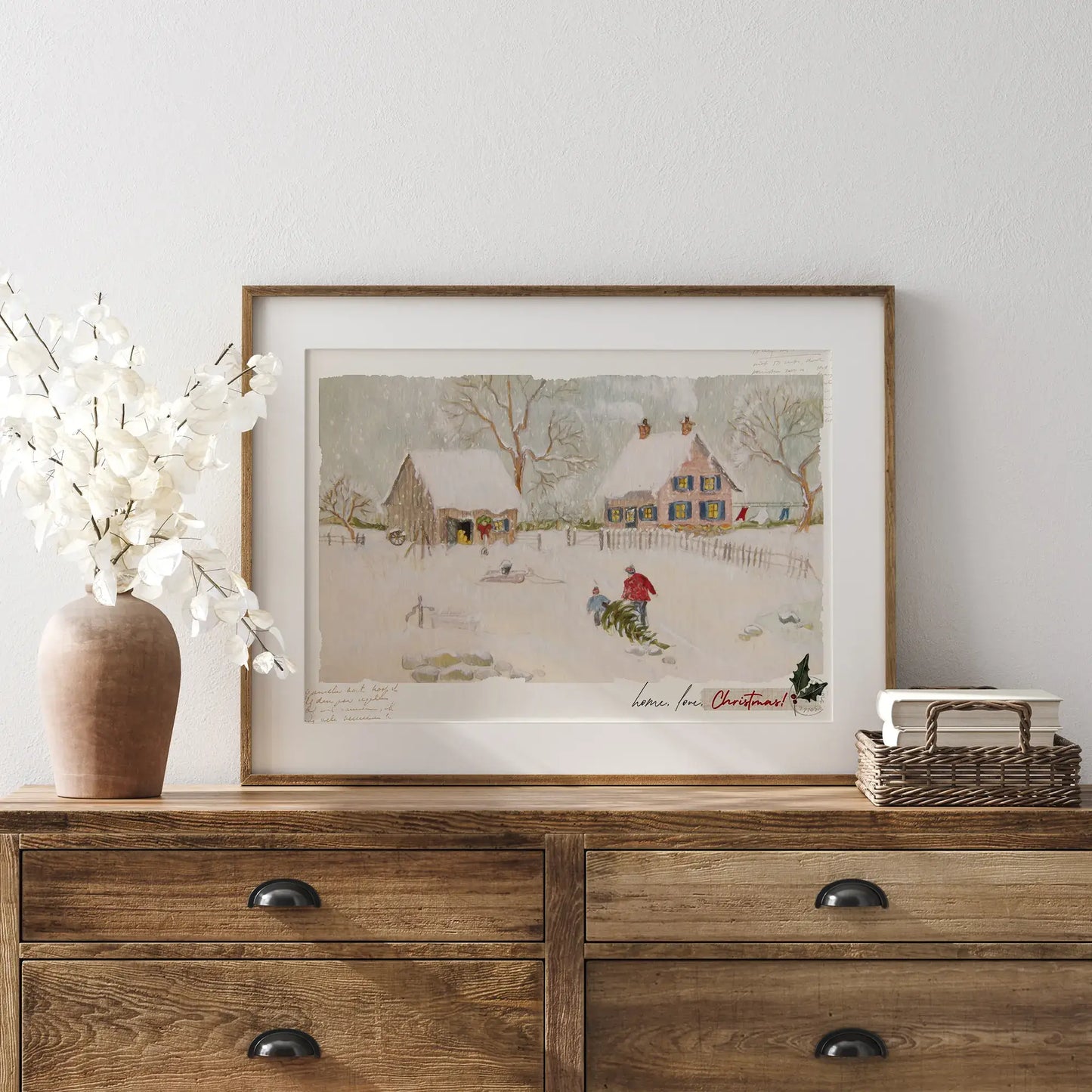 Home Love Christmas digital download winter scene print displayed on a wooden dresser with decorative vase.