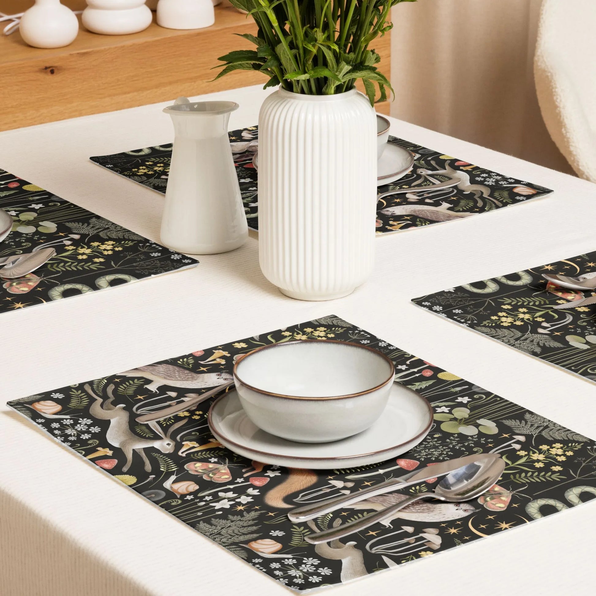 dining table with Magic Forest PLACEMATS from Blue Water Songs on it