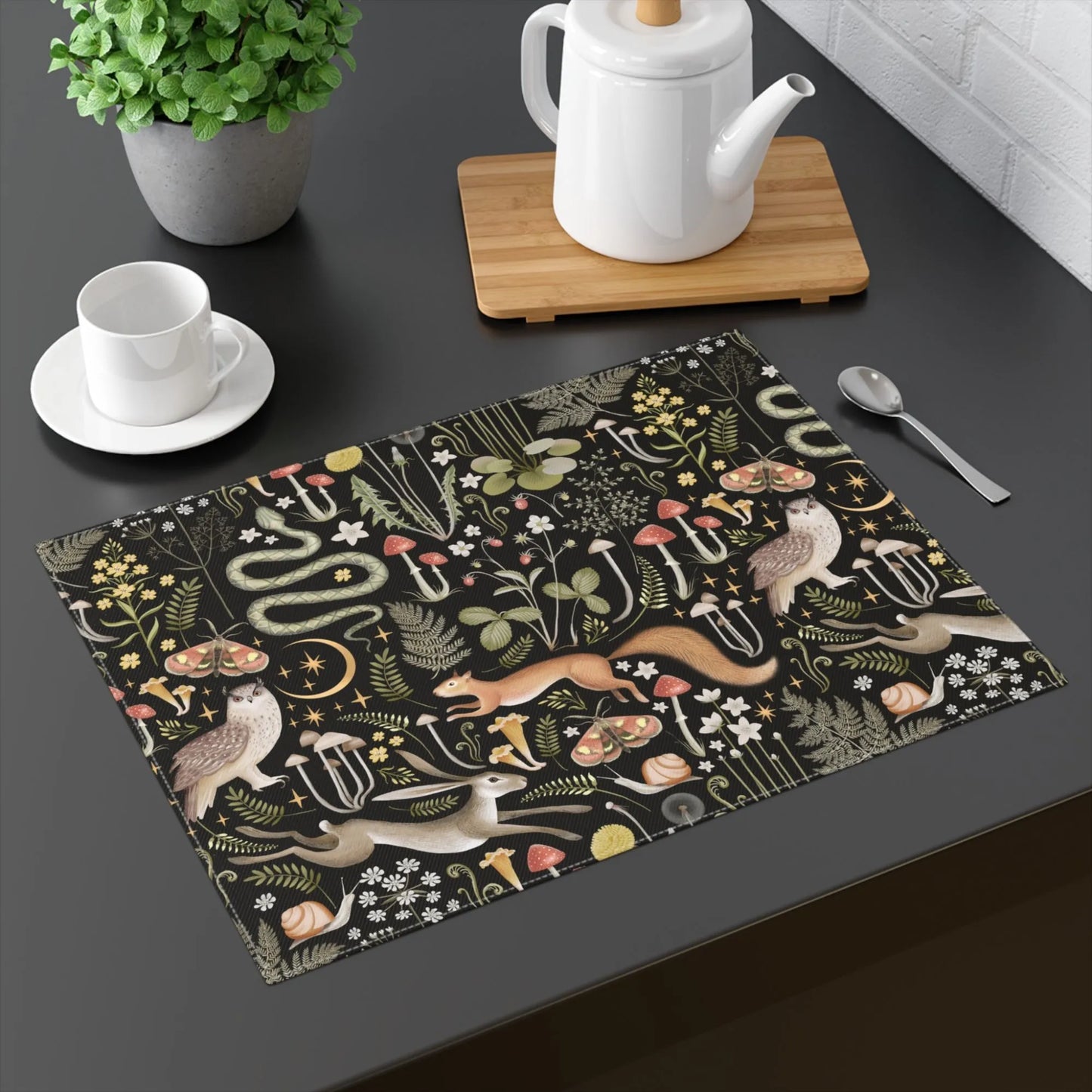 black table with black Magic Forest PLACEMATS from Blue Water Songs