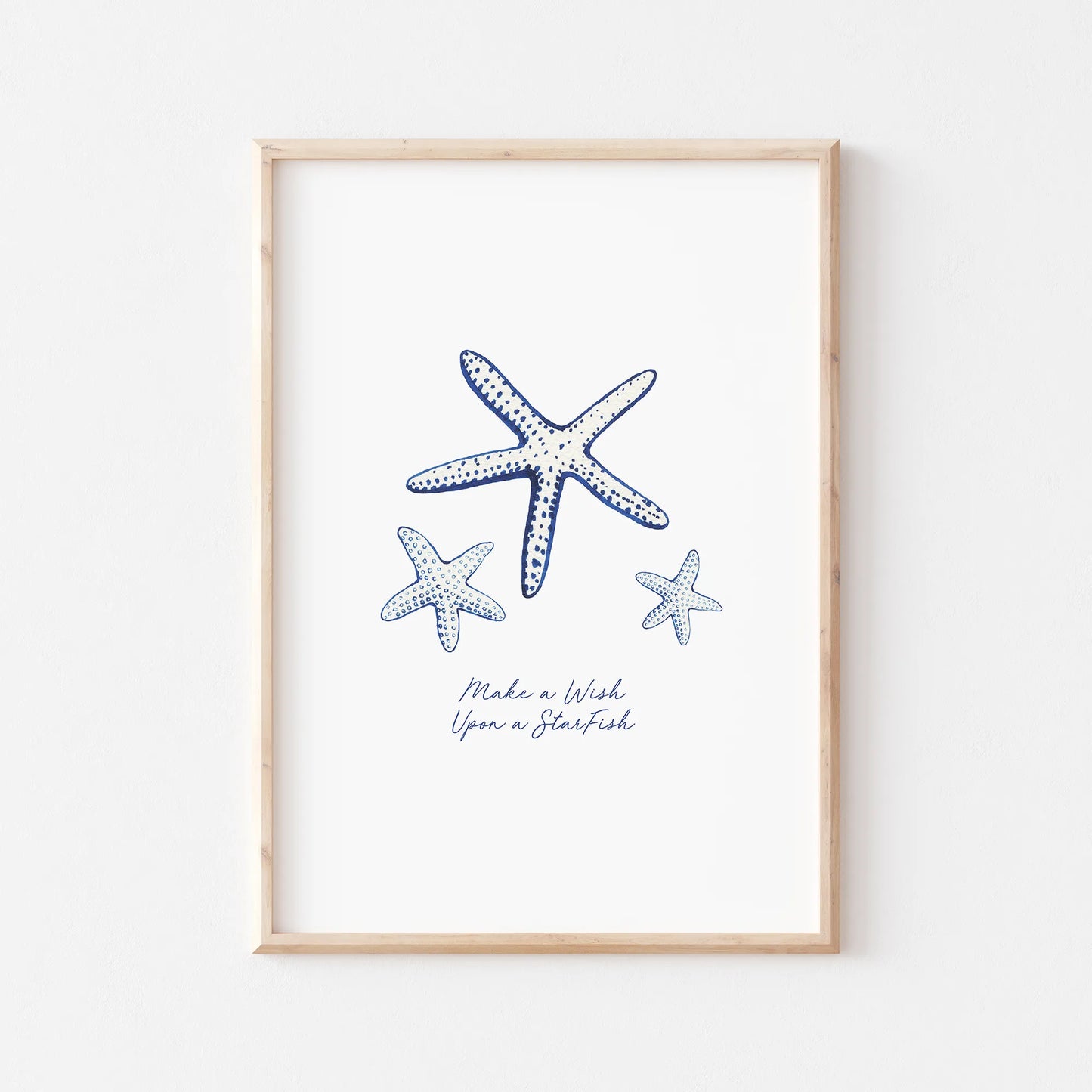 Coastal prints featuring watercolor starfish illustrations in blue and white, perfect for beach-themed decor.