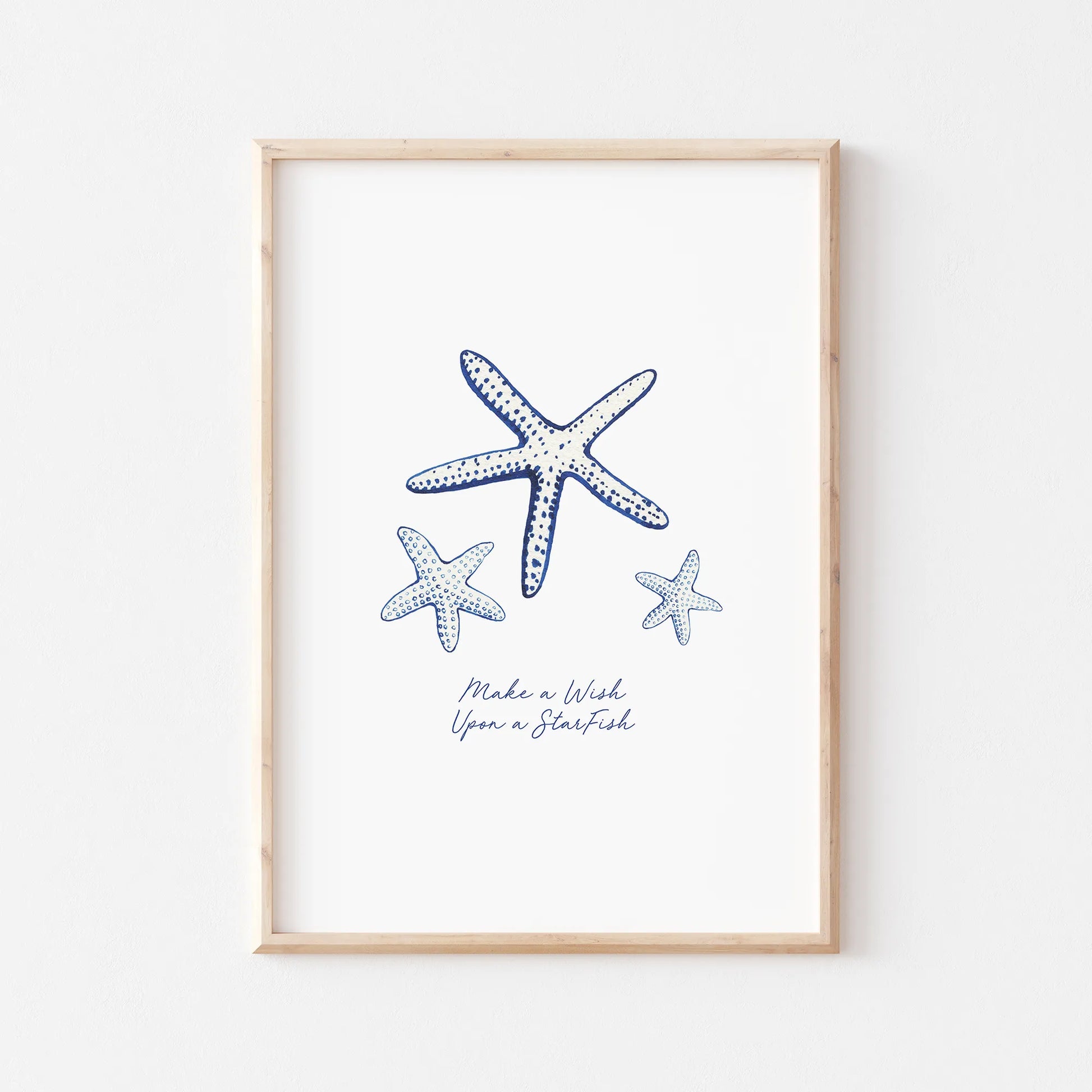 Coastal prints featuring watercolor starfish illustrations in blue and white, perfect for beach-themed decor.