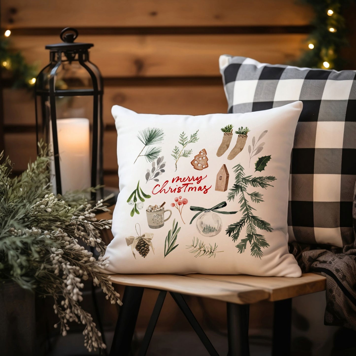Merry Christmas watercolor pillow styled outdoors on wooden bench with candle lantern and buffalo plaid cushion