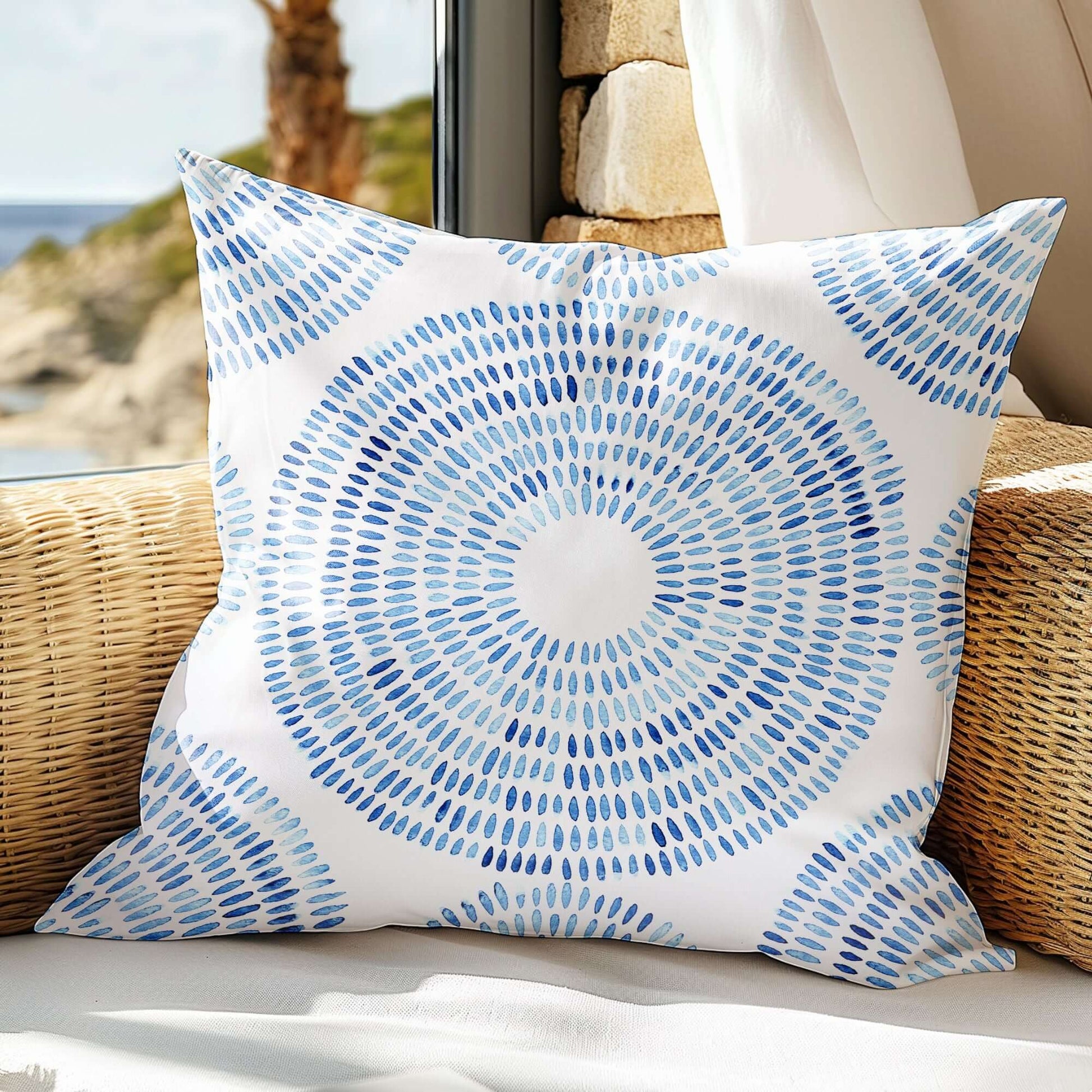 Seashell pillow on rattan chair— modern beach house decor
