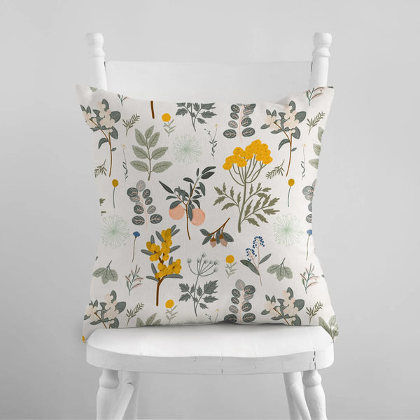 white chair with Autumn botanical PILLOW from Blue Water Songs on it