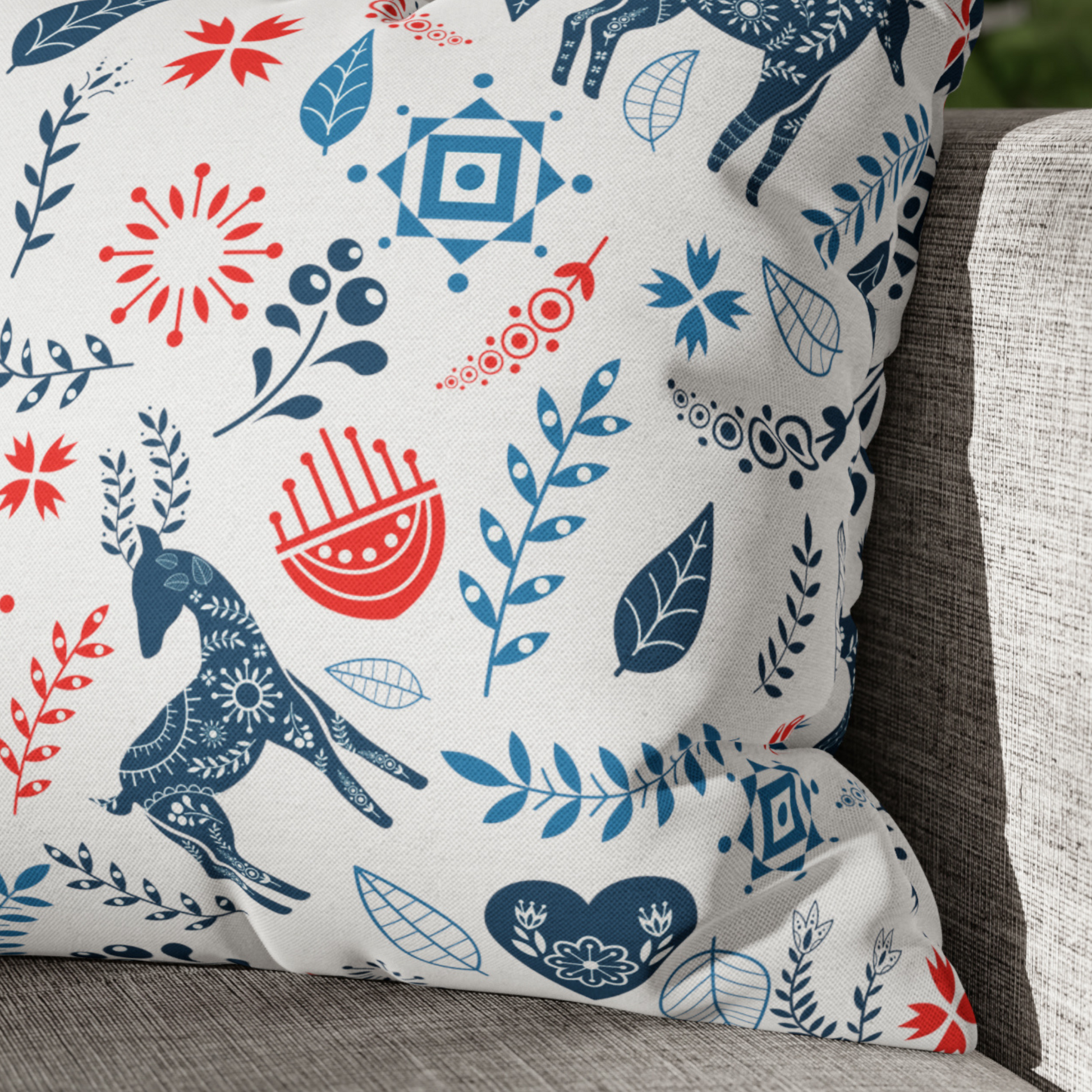 Reindeer Christmas Pillow Cover – Nordic Folk Art Holiday Decor with reindeer and floral patterns in blue and red.