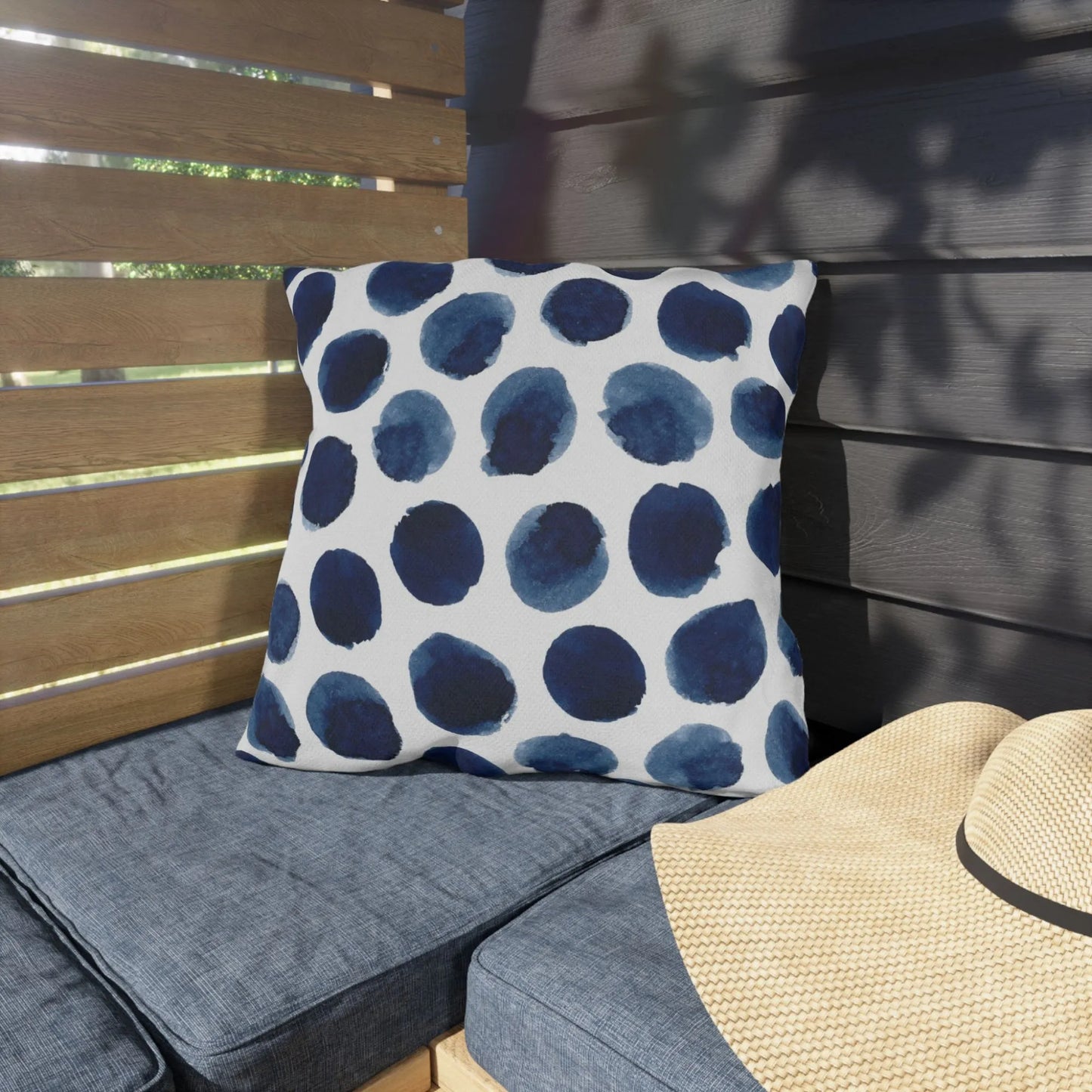 garden porch with Watercolor Navy and White OUTDOOR PILLOW sitting on the bench