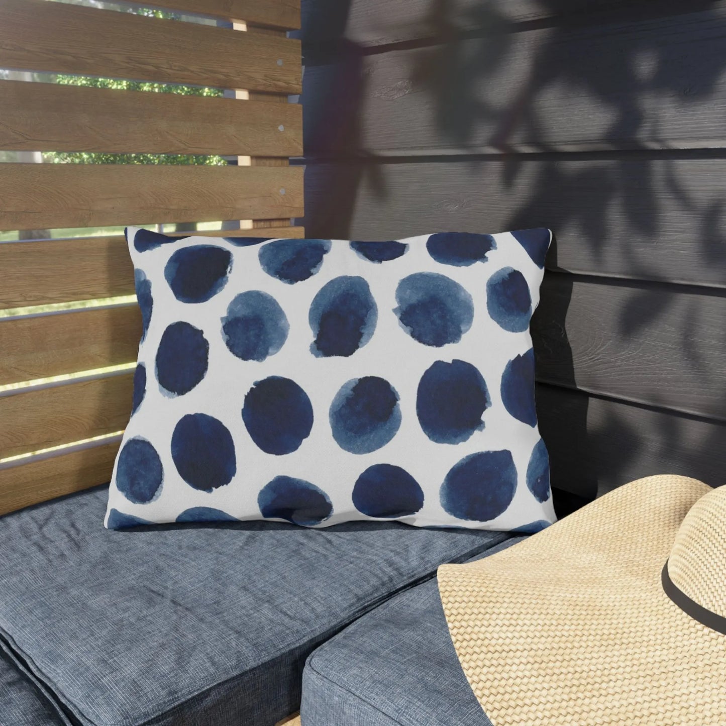 Watercolor Navy and White OUTDOOR lumbar PILLOW sitting on outdoor bench