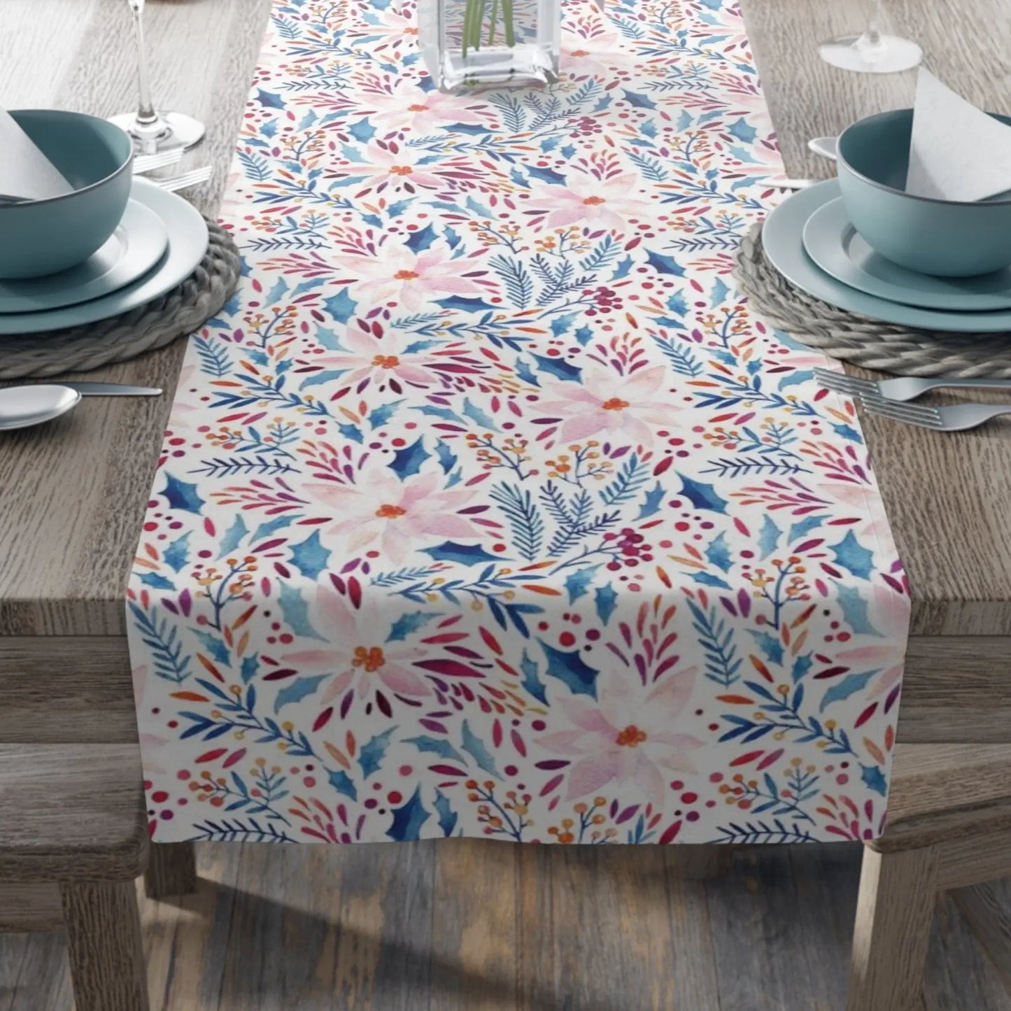 Pink Poinsettia Winter Table Runner displayed on a dining table with elegant dishware.