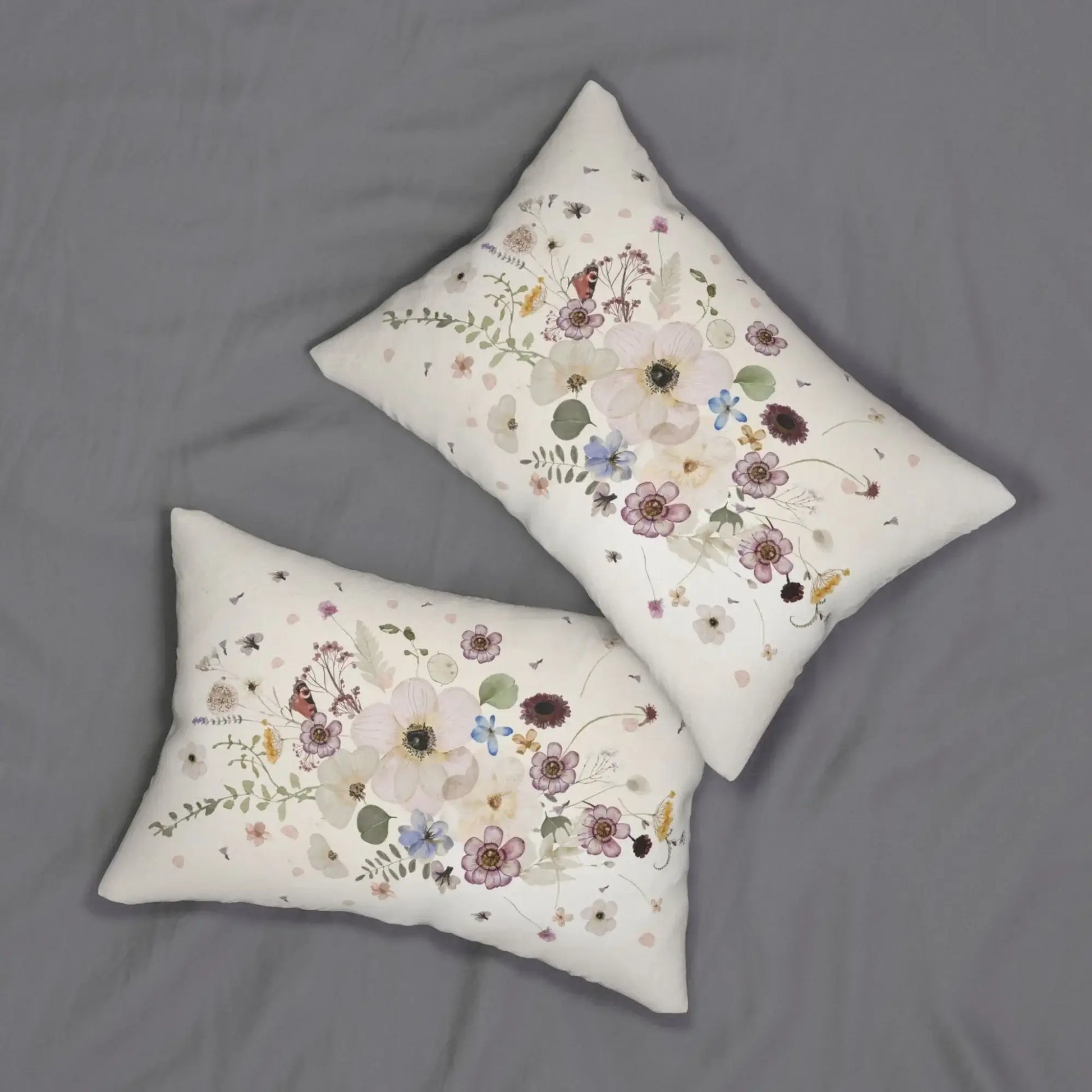 Pressed Flowers spring PILLOW featuring delicate watercolor florals and greenery on a soft fabric surface.