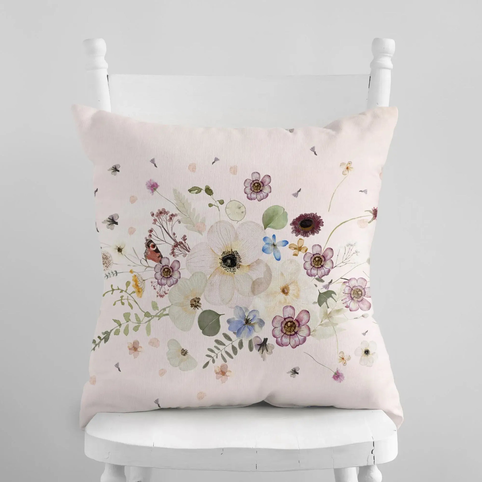Pressed Flowers spring PILLOW with delicate watercolor florals on a soft pink background.