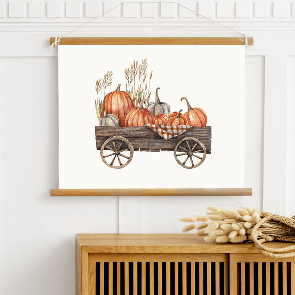 Pumpkin Cart wall art from Blue Water Songs hanging on white wall