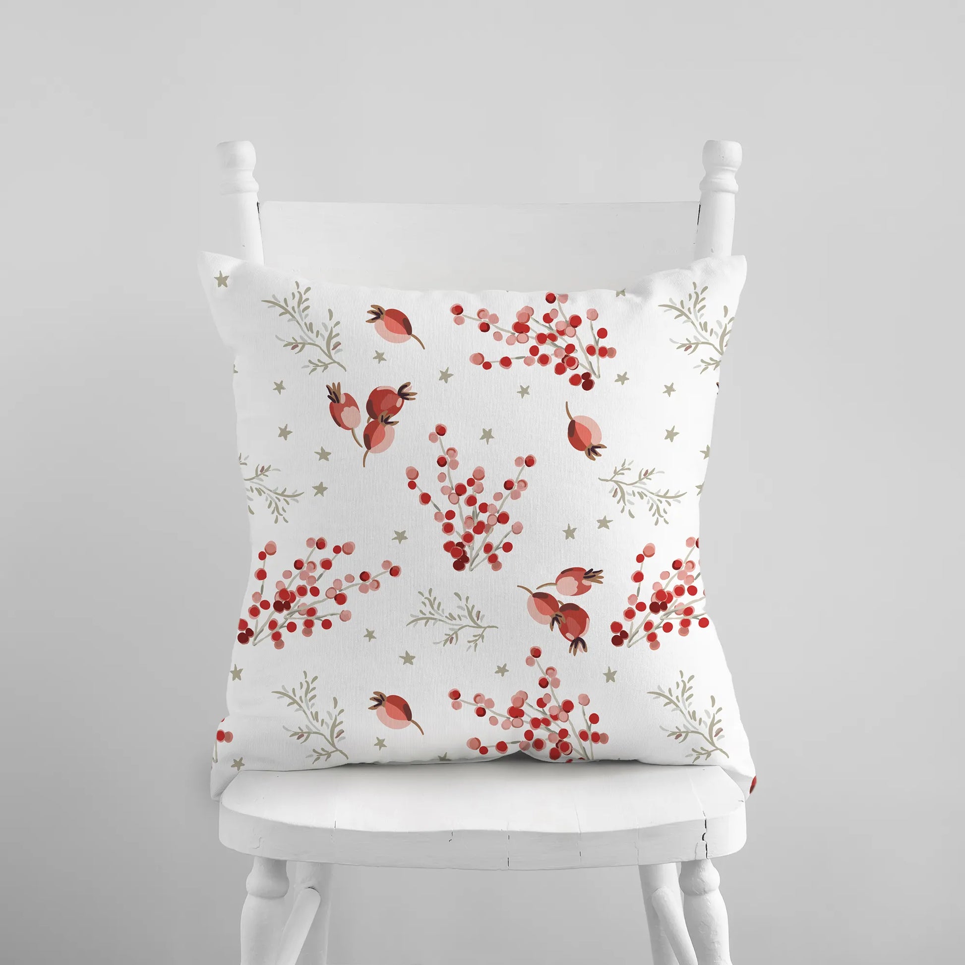 white chair with red berry winter pillow from Blue Water Songs