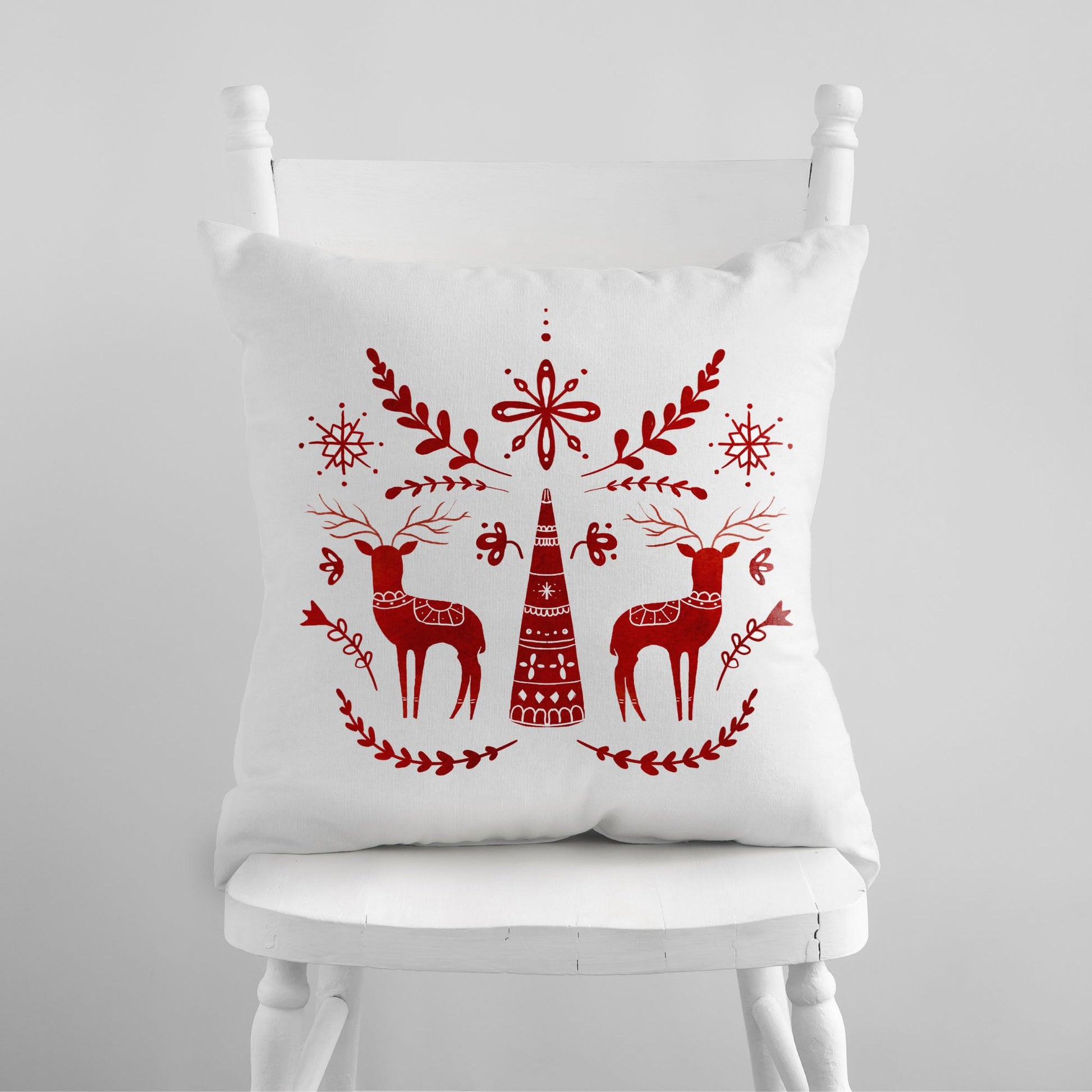 Red Deer Nordic Christmas PILLOW from Blue Water Songs sitting on white chair