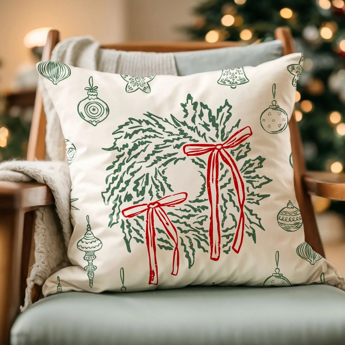 Retro Christmas Pillow featuring a green wreath and red bows on soft ivory fabric, perfect for vintage holiday decor.