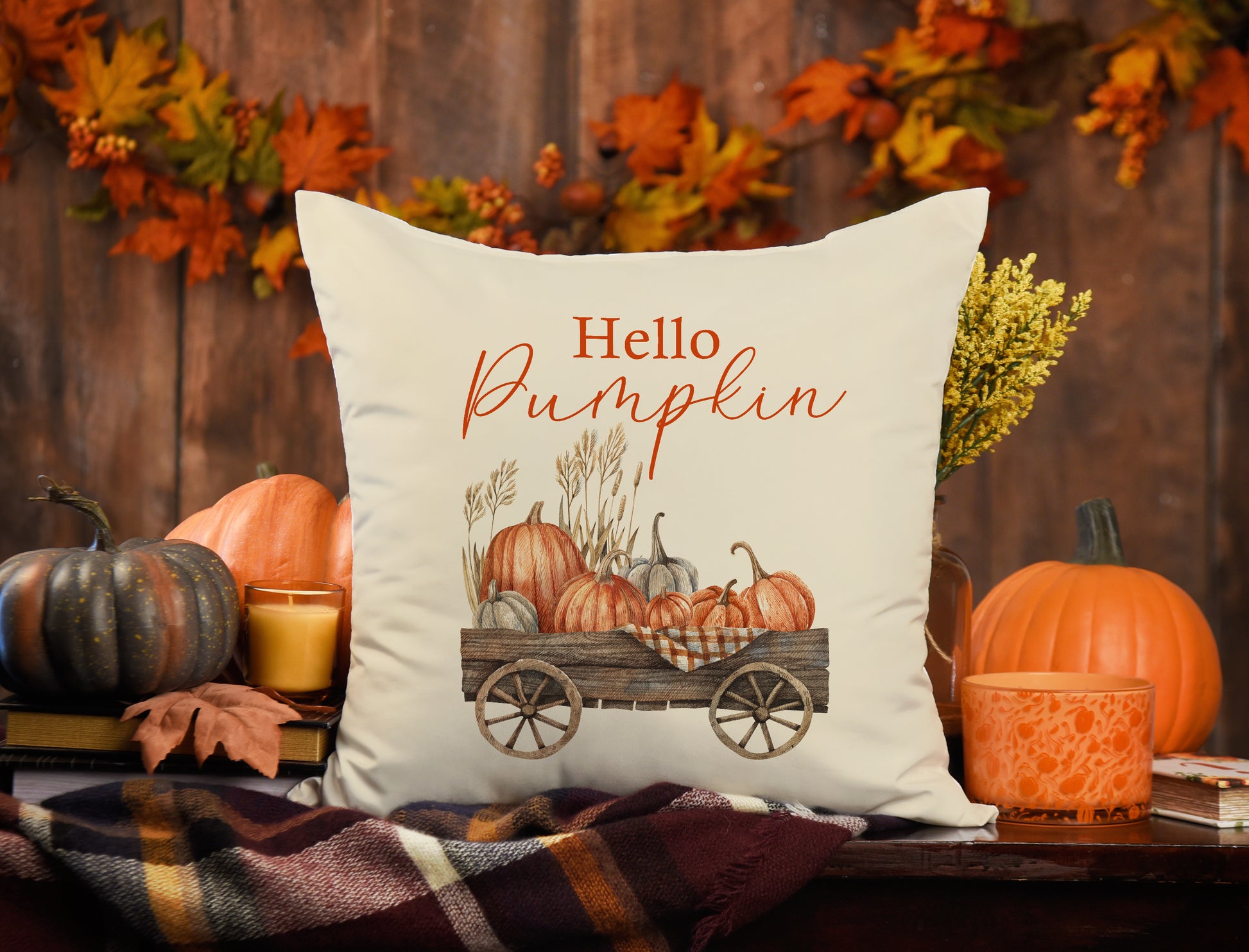 autumn farmhouse decoration with throw pillows and pumpkins around