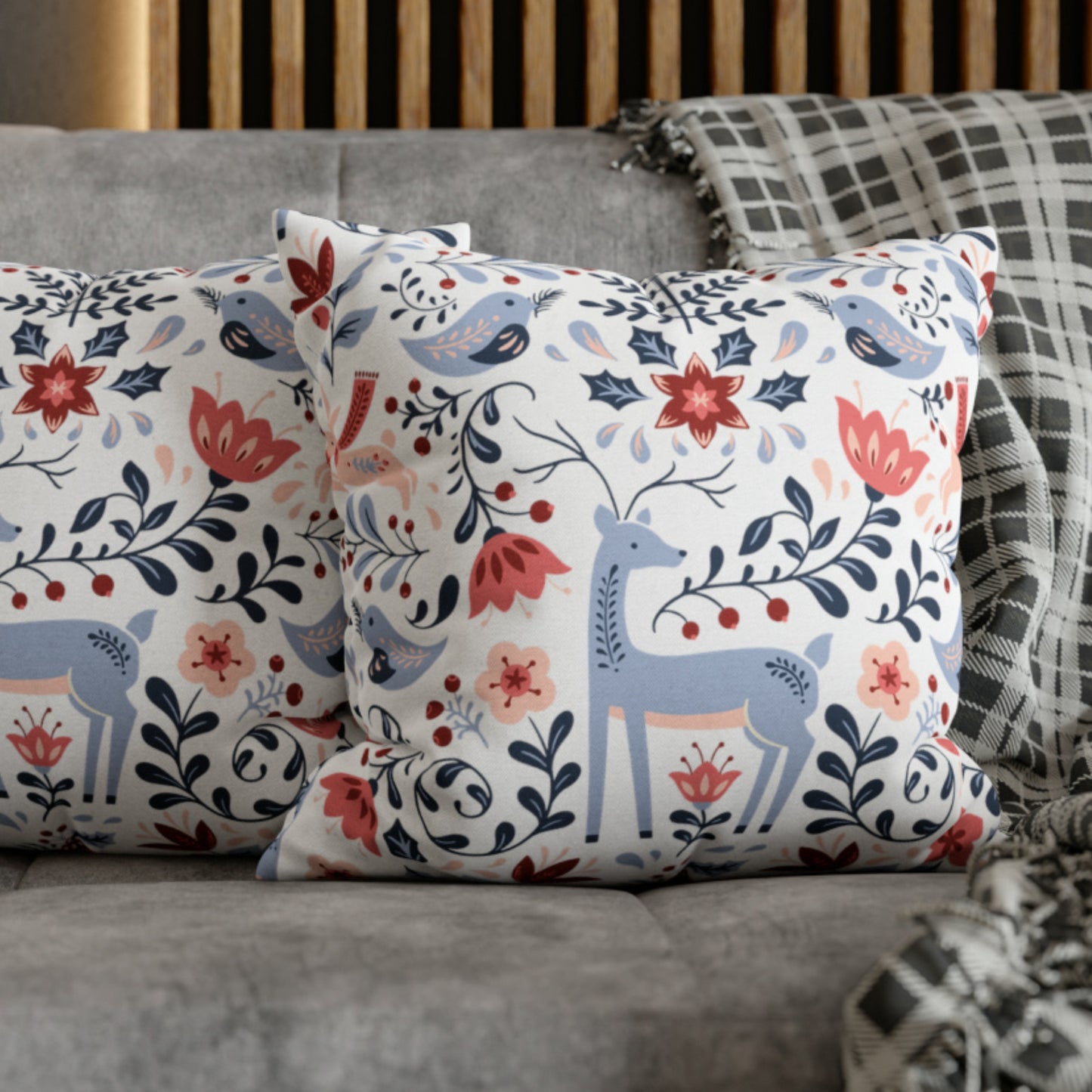 Nordic Reindeer Christmas Pillow featuring festive reindeer and floral designs on cozy couch decor