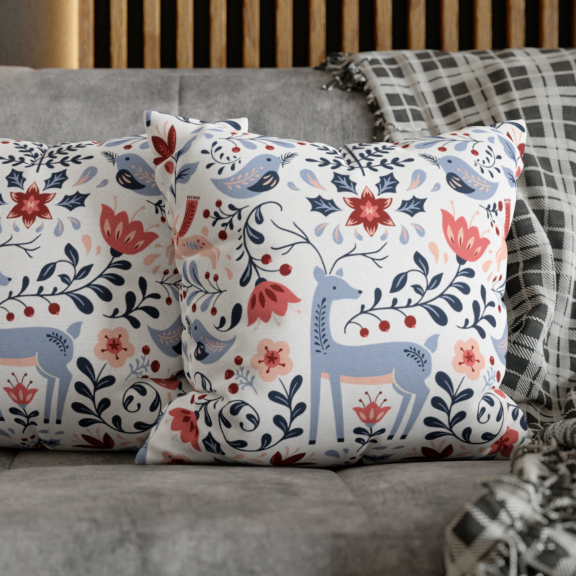 Nordic Reindeer Christmas Pillow featuring festive reindeer and floral designs on cozy couch decor