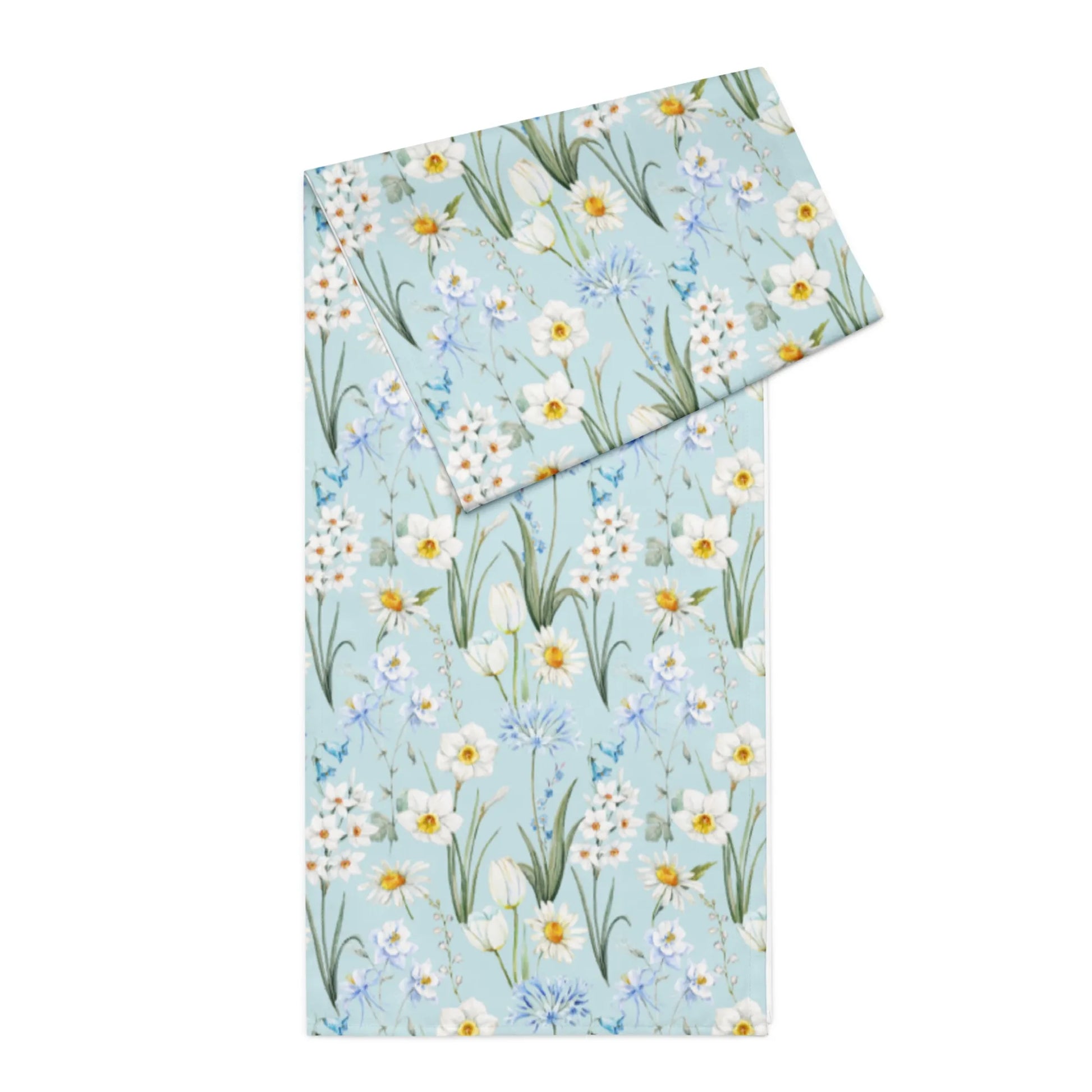 Spring Meadow Table Runner showcasing delicate watercolor flowers in soft blues, whites, and greens.