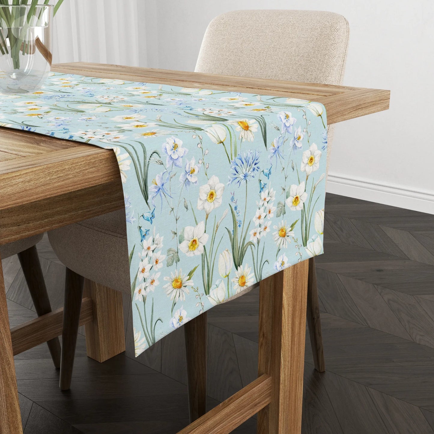 Spring Meadow Table Runner featuring delicate watercolor flowers on a light blue background, enhancing any dining space.
