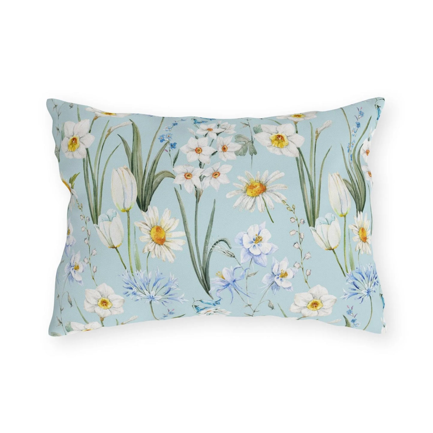 Lumbar outdoor pillow with watercolor wildflowers on a soft blue background featuring daisies, tulips, and daffodils.