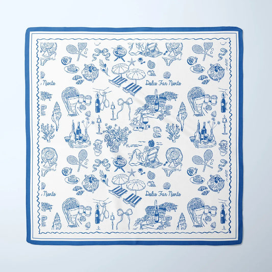 The Dolce Moment Silk Scarf in blue and white with Italian summer illustrations and “Dolce Far Niente” text in vintage line art style.