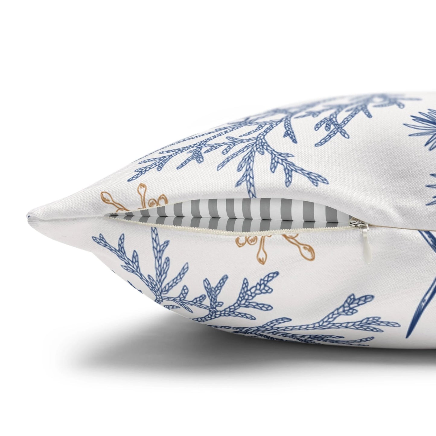 Close-up of vintage blue bird botanical winter pillow with hidden zipper on white background