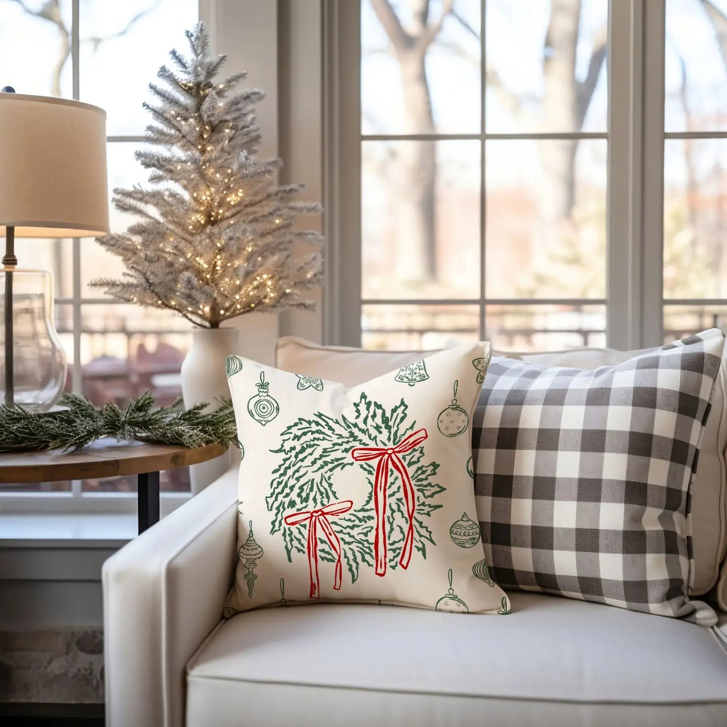 Retro Christmas Pillow displayed on a cozy chair, adorned with green wreaths and red bows, enhancing holiday decor.