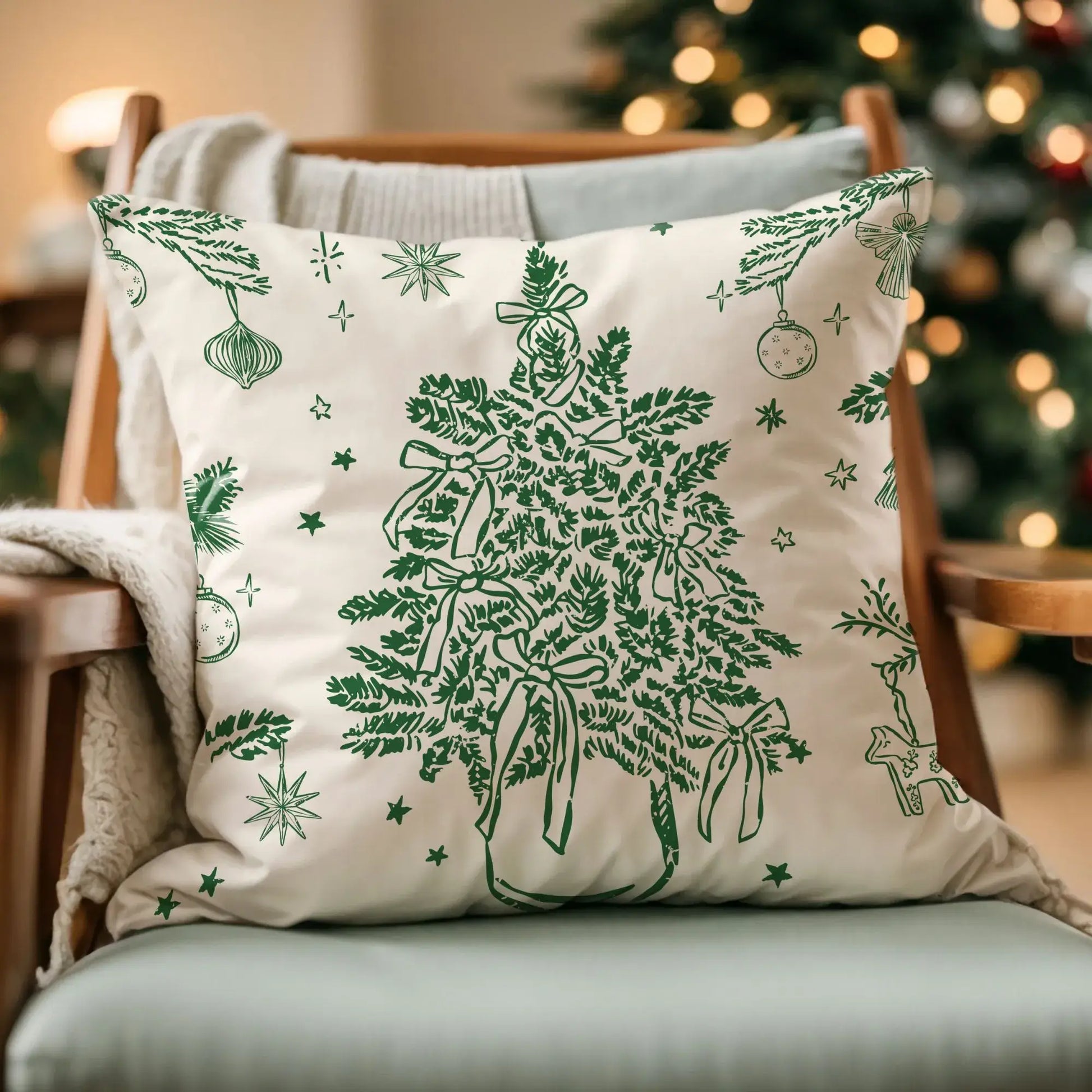 Vintage Christmas tree pillow cover with green botanical design styled on sofa near Christmas tree