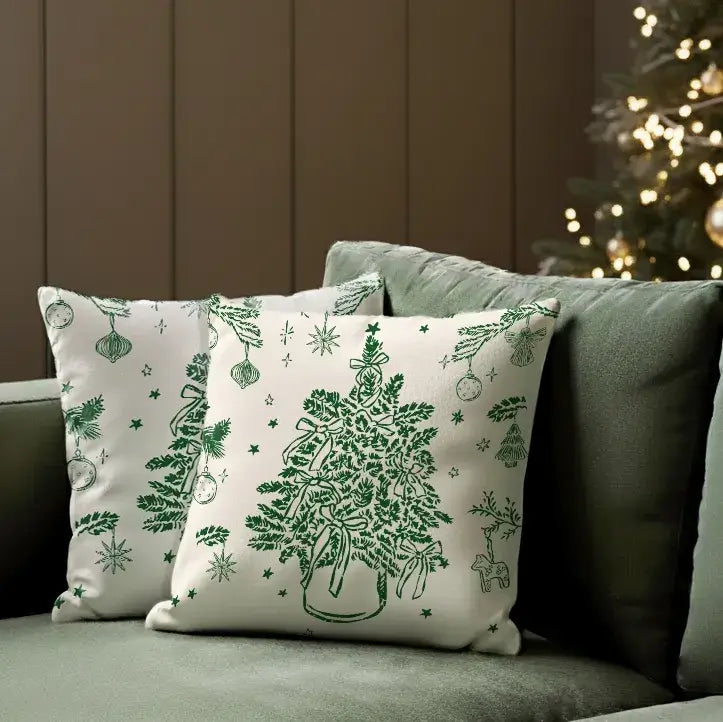 Vintage Christmas Tree Pillow Cover with green botanical design styled on sofa near Christmas tree