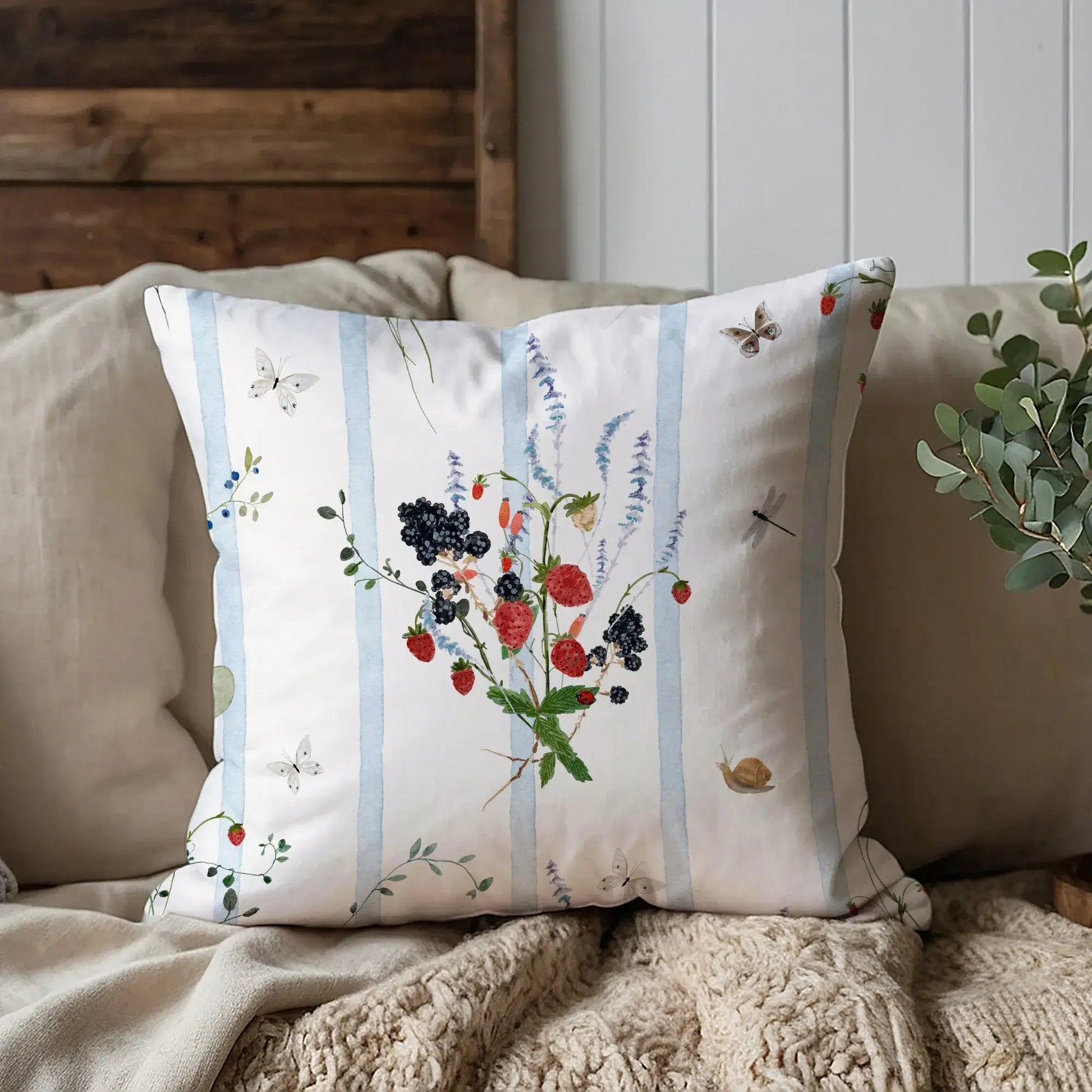 Watercolor Berry Botanical Pillow featuring watercolor strawberries, blackberries, and soft blue stripes.