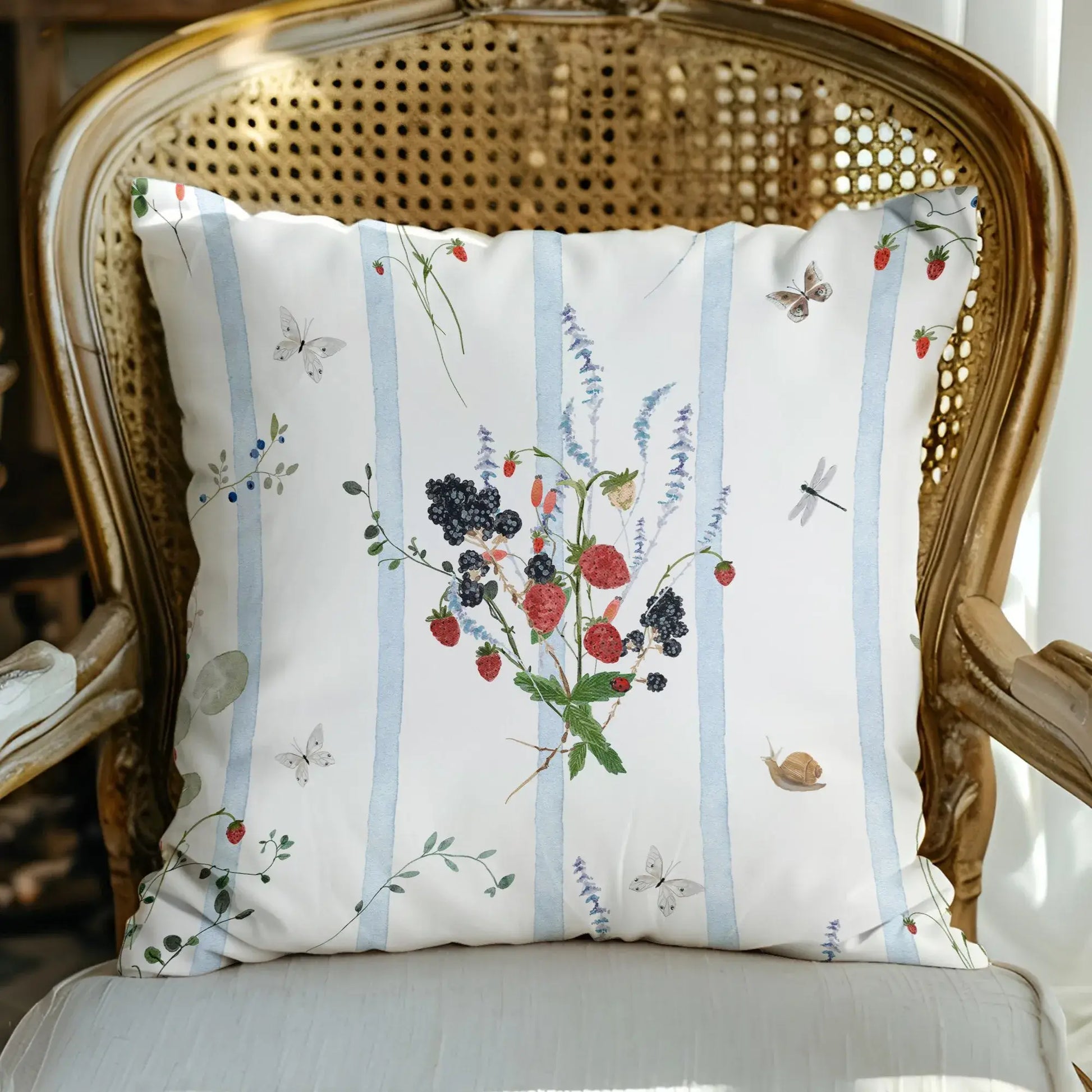Watercolor Berry Botanical Pillow featuring watercolor strawberries, blackberries, and soft blue stripes.