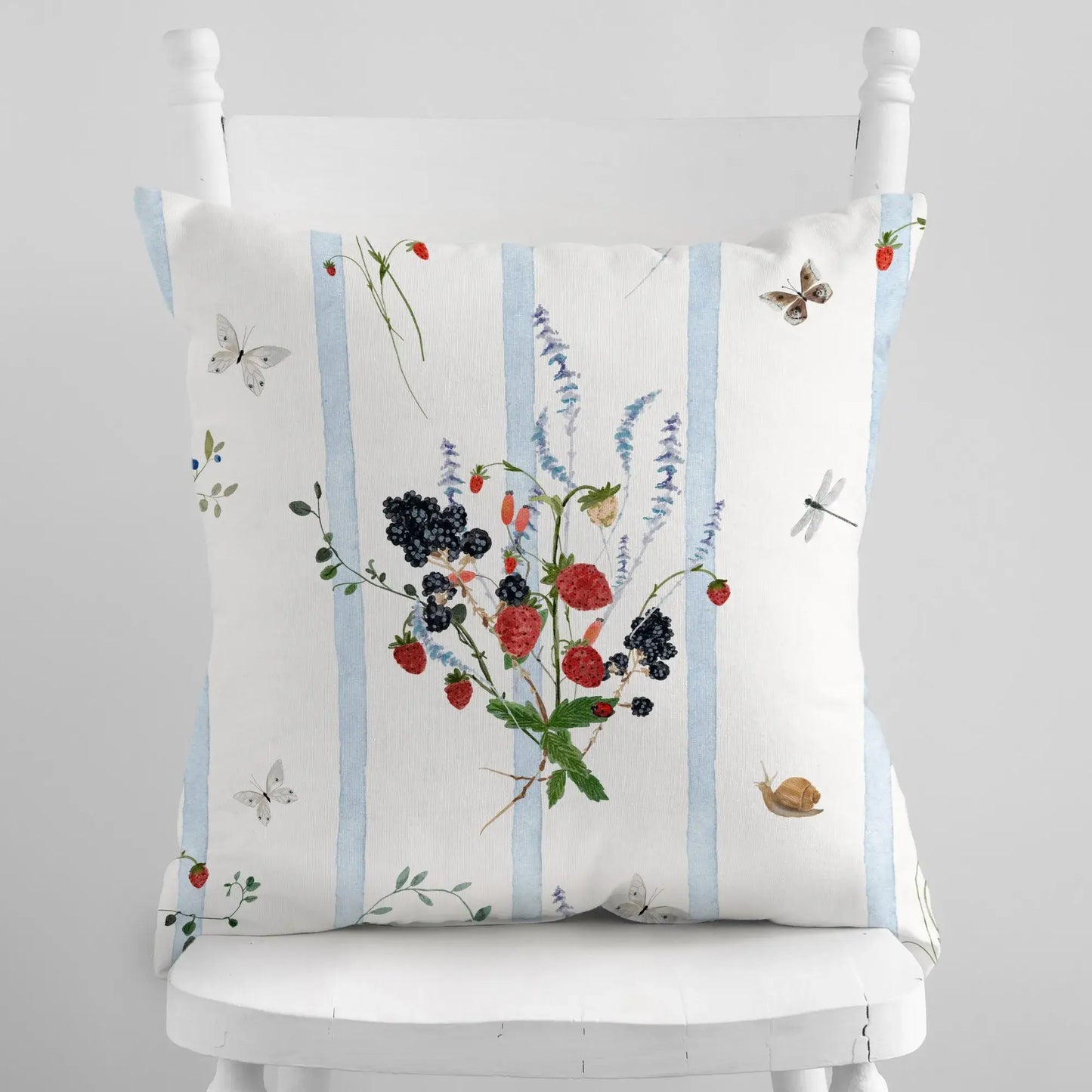 Watercolor Berry Botanical Pillow featuring strawberries and blackberries with blue striped background.
