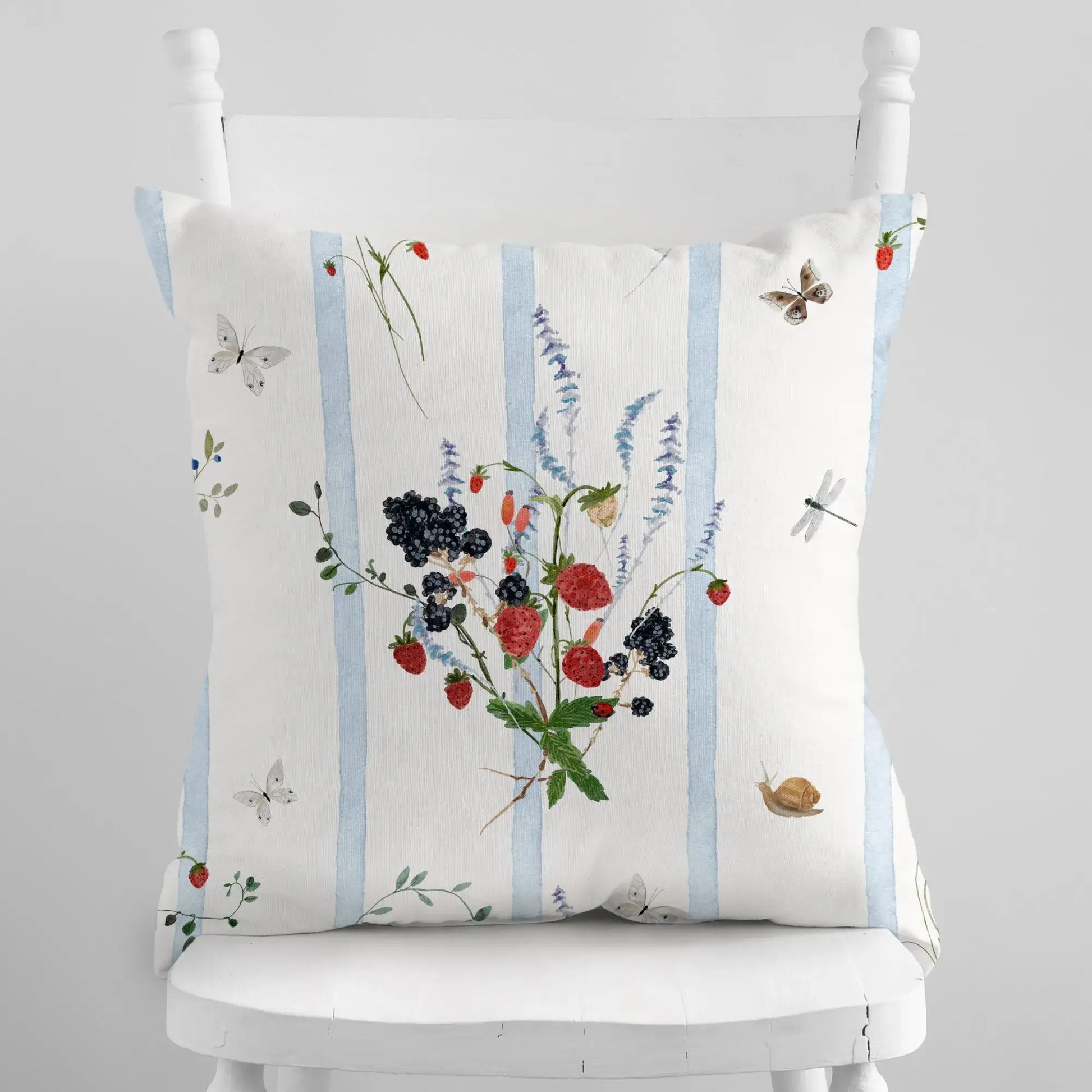Watercolor Berry Botanical Pillow featuring strawberries and blackberries with blue striped background.