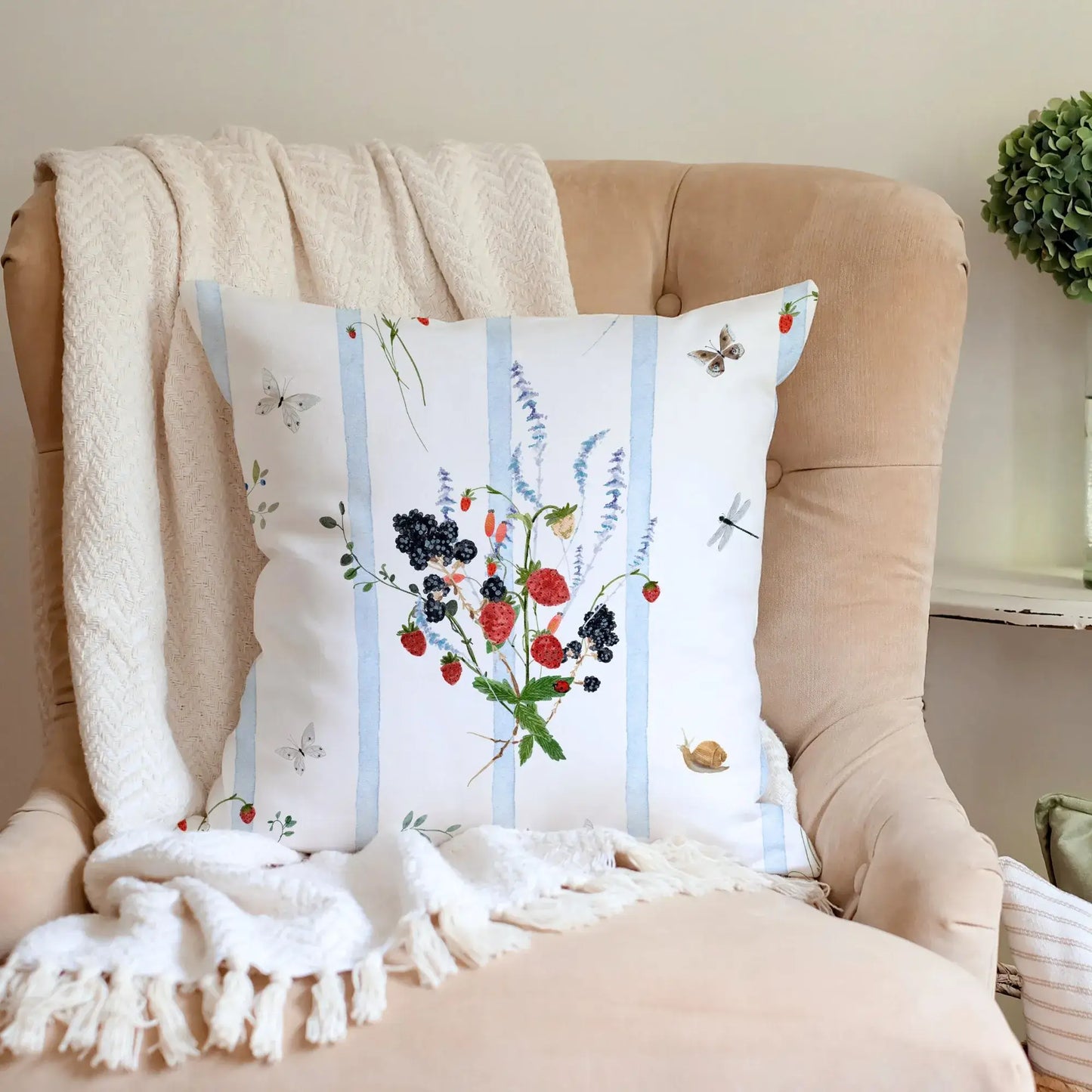 Watercolor Berry Botanical Pillow featuring strawberries and blackberries on a soft blue striped background.