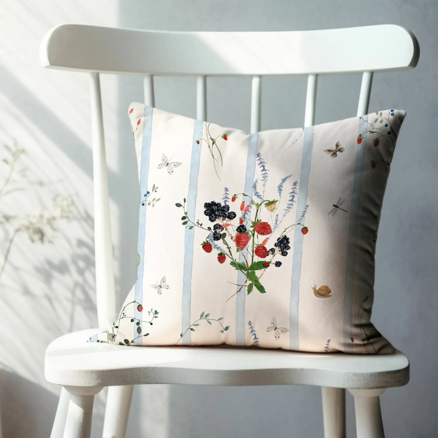 Watercolor Berry Botanical Pillow featuring watercolor strawberries and blackberries on a striped background.