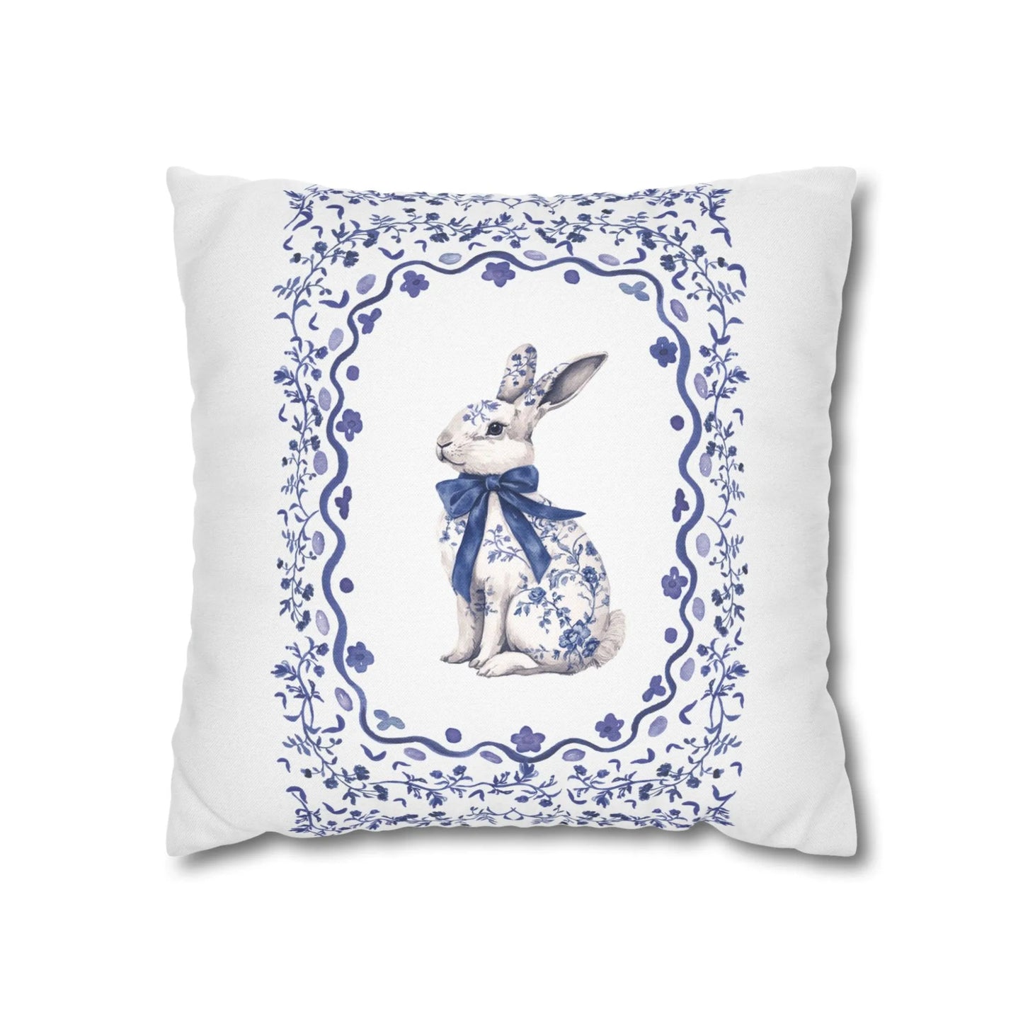 Square white pillowcase with a blue watercolor Chinoiserie rabbit wearing a bow, enclosed in a decorative floral frame.