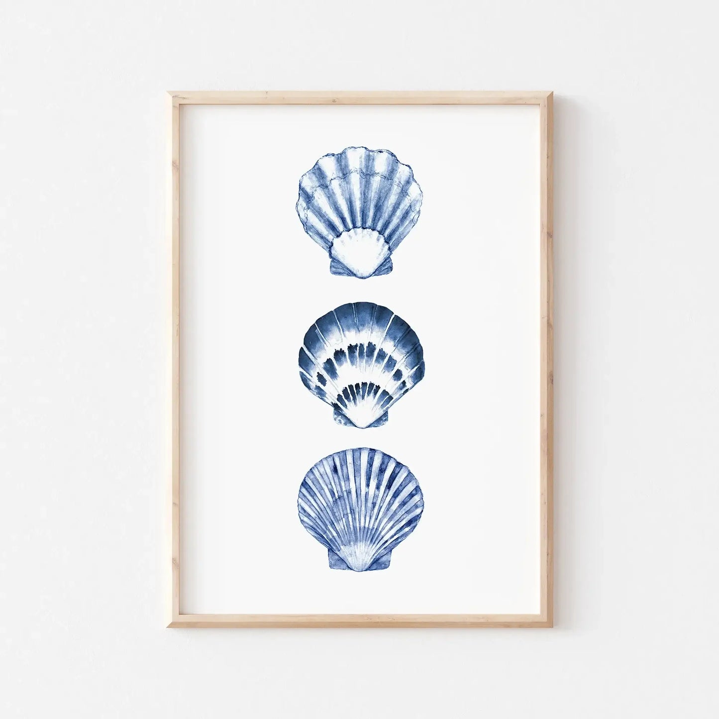 Watercolor blue seashells digital art print framed in wood, minimalist coastal wall decor for beach house or summer living spaces.