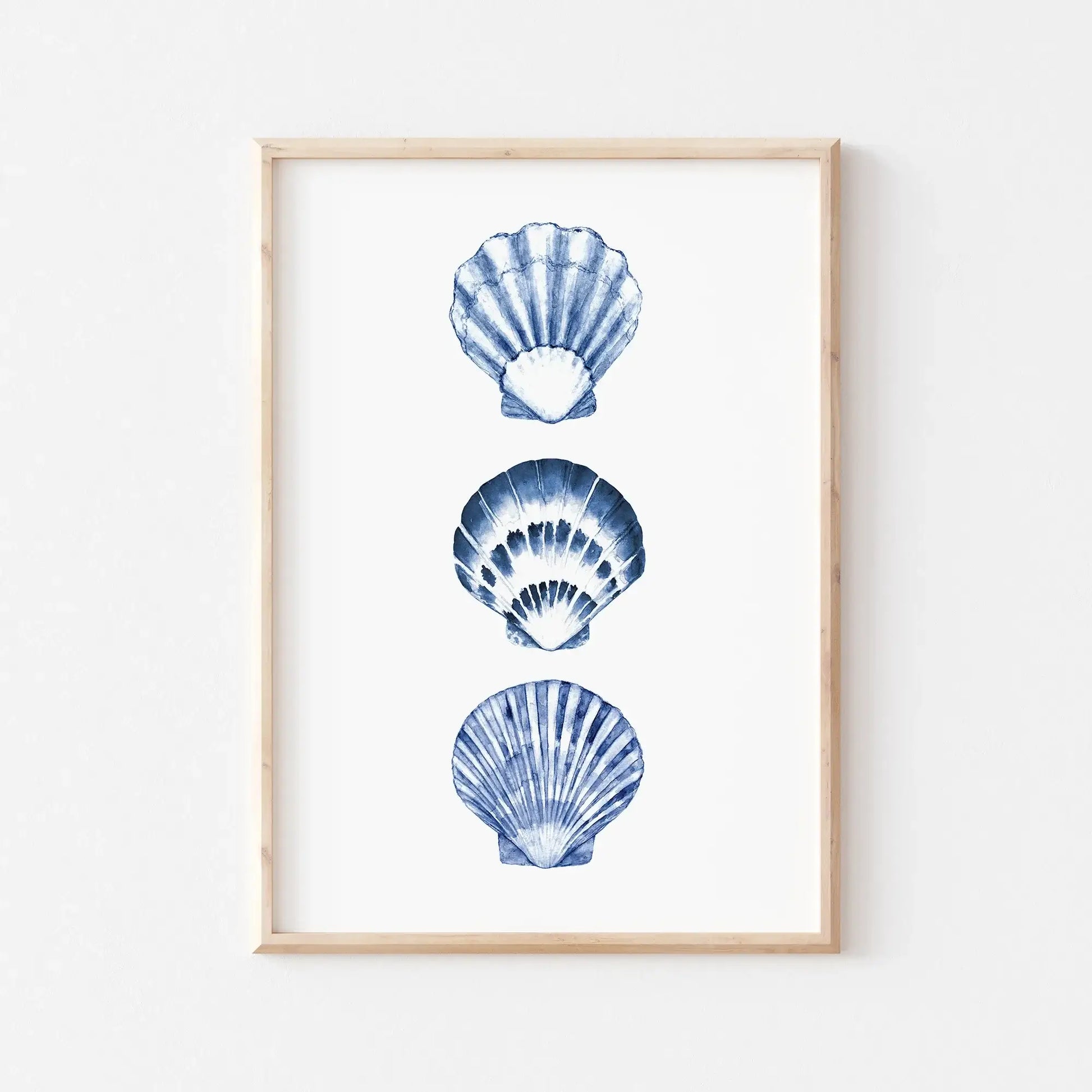 Watercolor blue seashells digital art print framed in wood, minimalist coastal wall decor for beach house or summer living spaces.