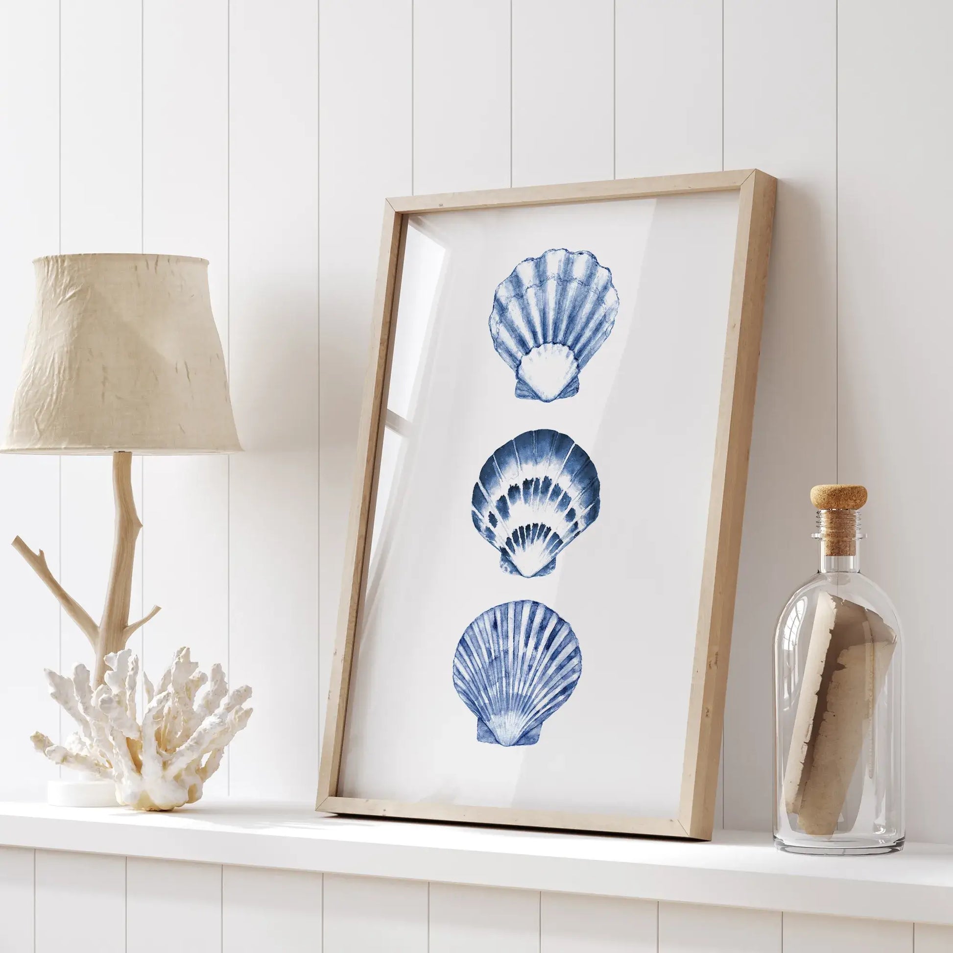 Watercolor blue seashells art print framed on white shelf with coastal natural decor, coral sculpture, and summer styling, instant digital download.