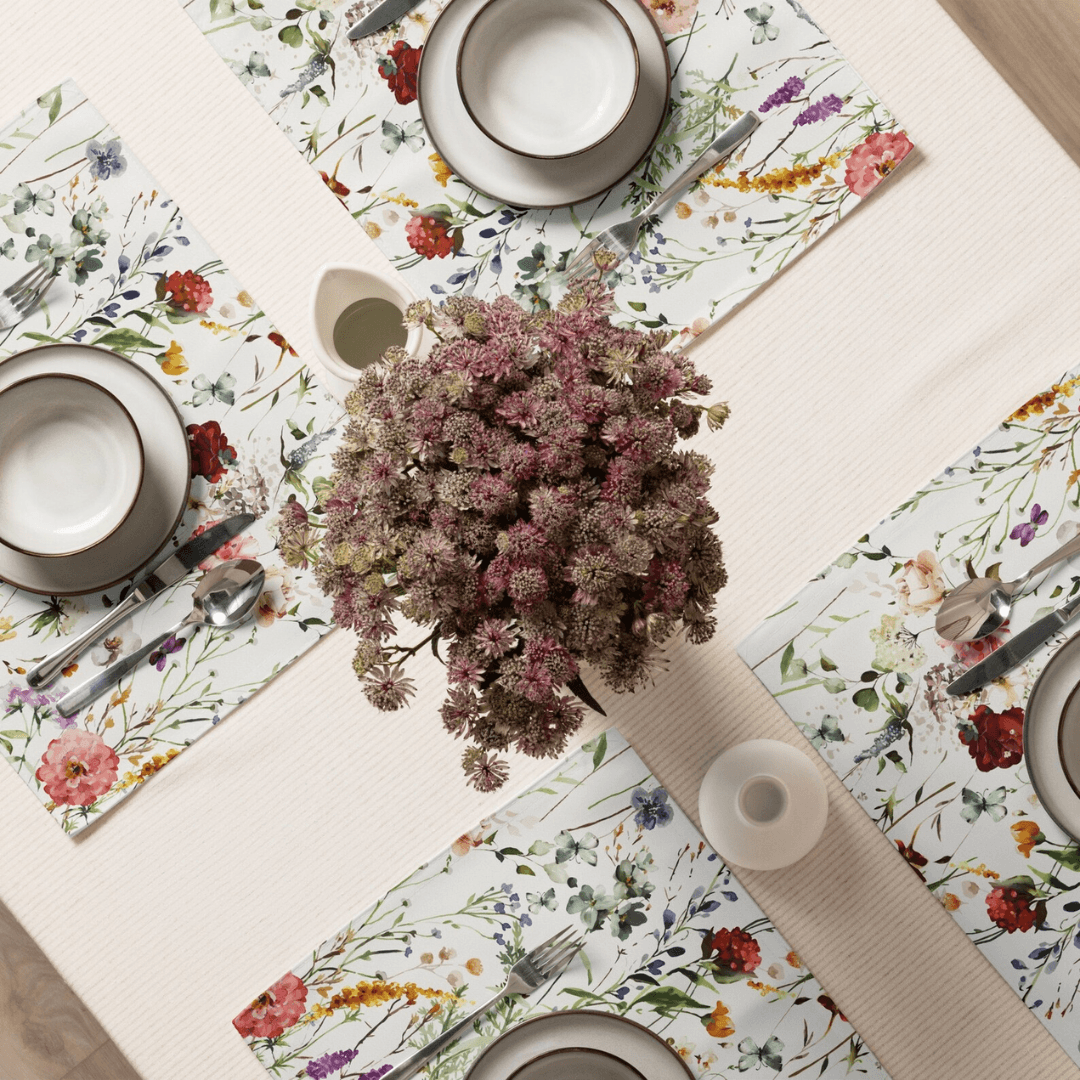 Watercolor Boho Wildflowers Placemat Set arranged on a dining table with dishes and a floral centerpiece.