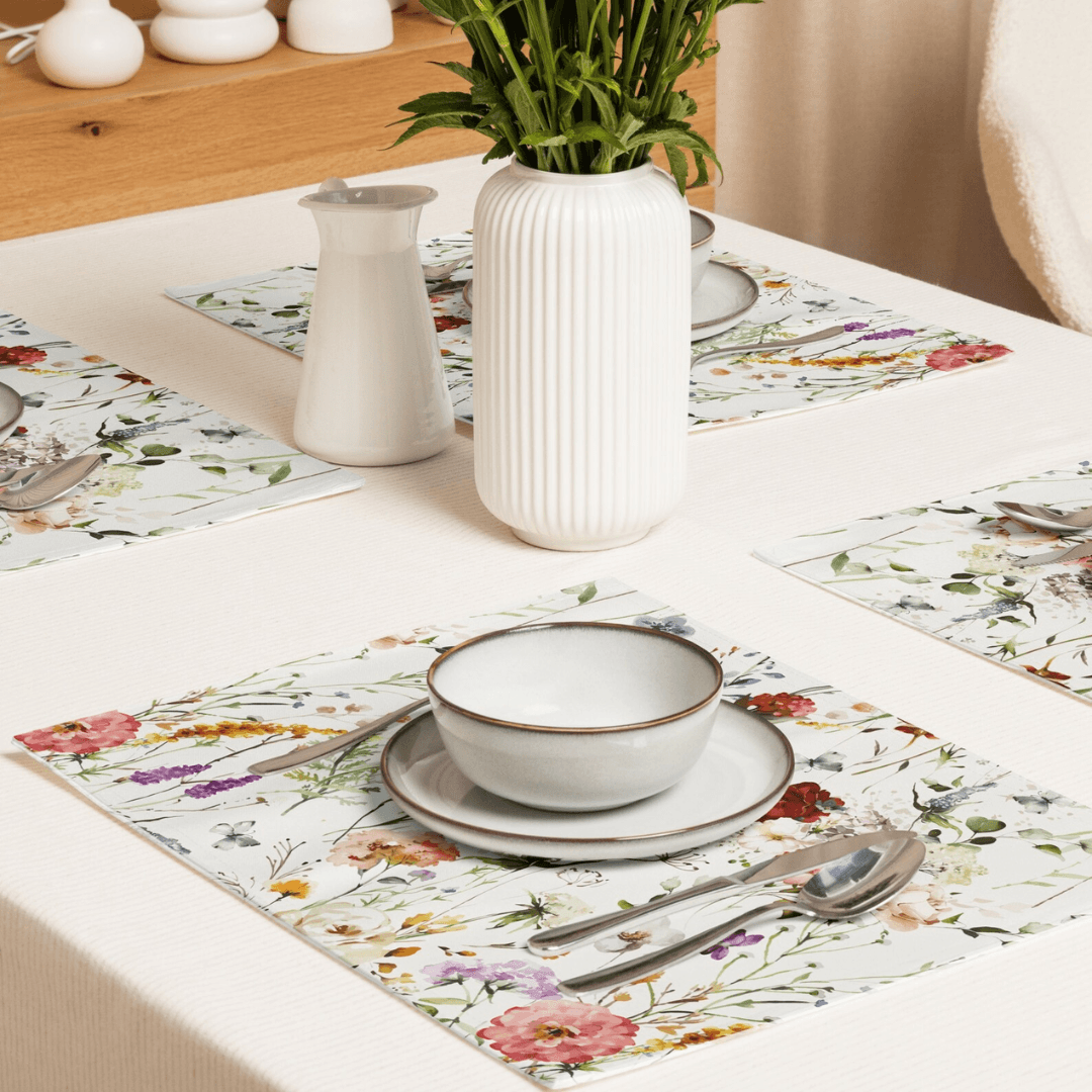Watercolor Boho Wildflowers Placemat Set on a dining table with a bowl, spoon, and plant centerpiece.
