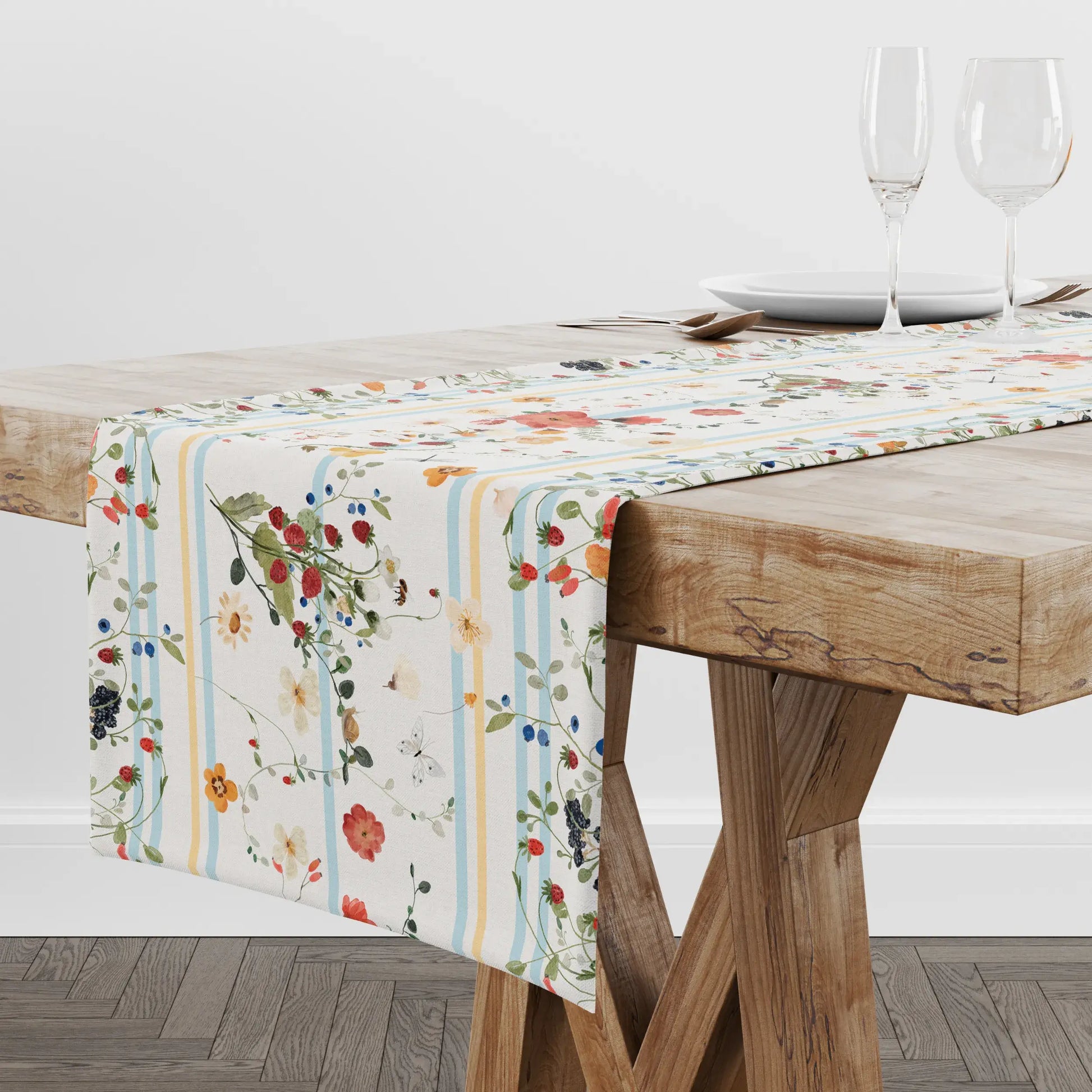 Watercolor Berry Botanical TABLE RUNNER displayed on a wooden table with elegant glassware, featuring floral designs.